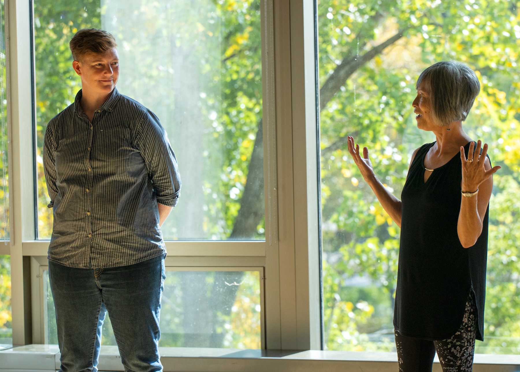 Connie Kassor (left) and Linda Morgan-Clement talk during a Doing Nothing class session.