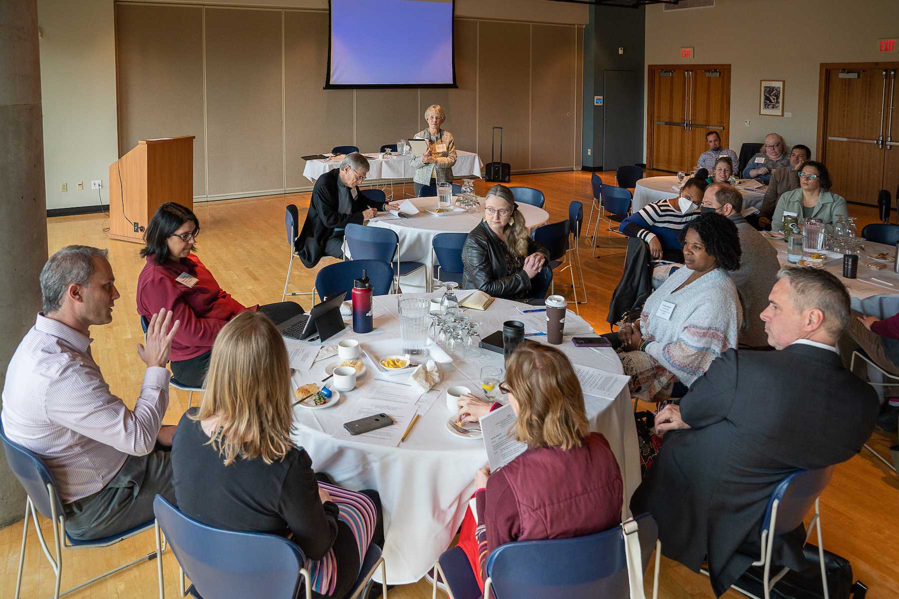 Scott Corry speaks with other faculty and staff during the Gardner Institute Workshop.