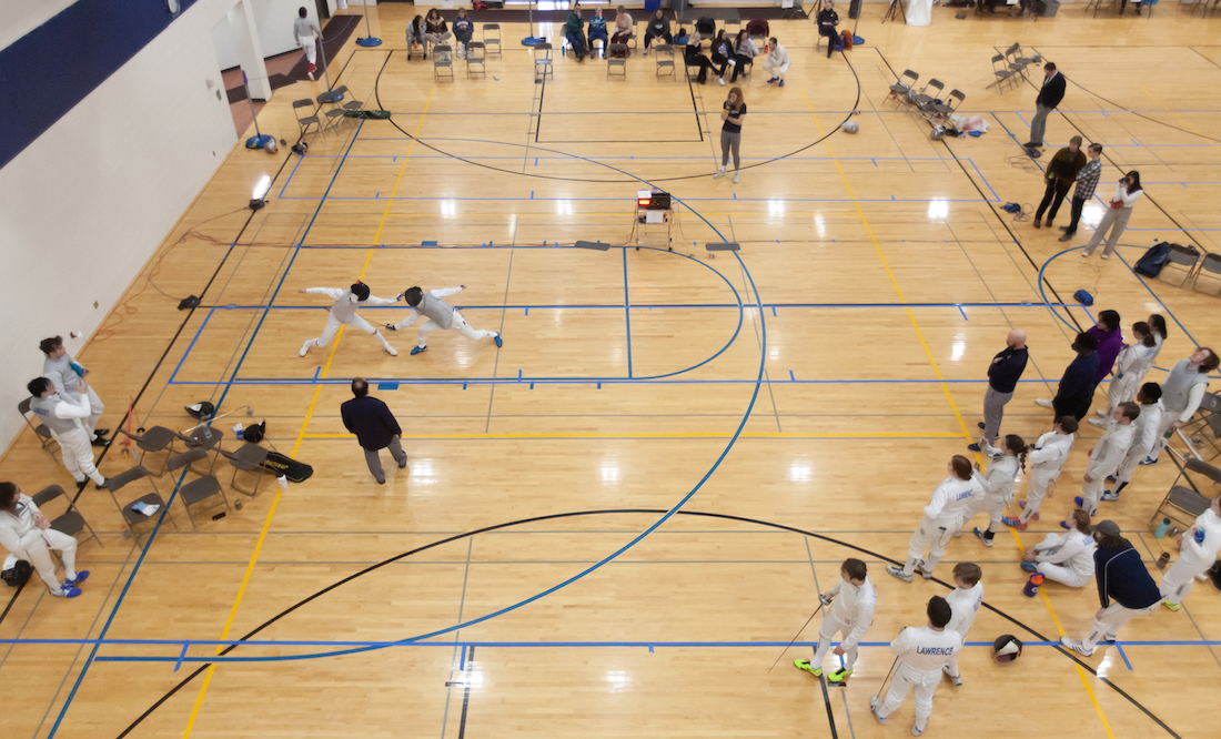 A view from above as fencers do battle in the Wellness Center gym.