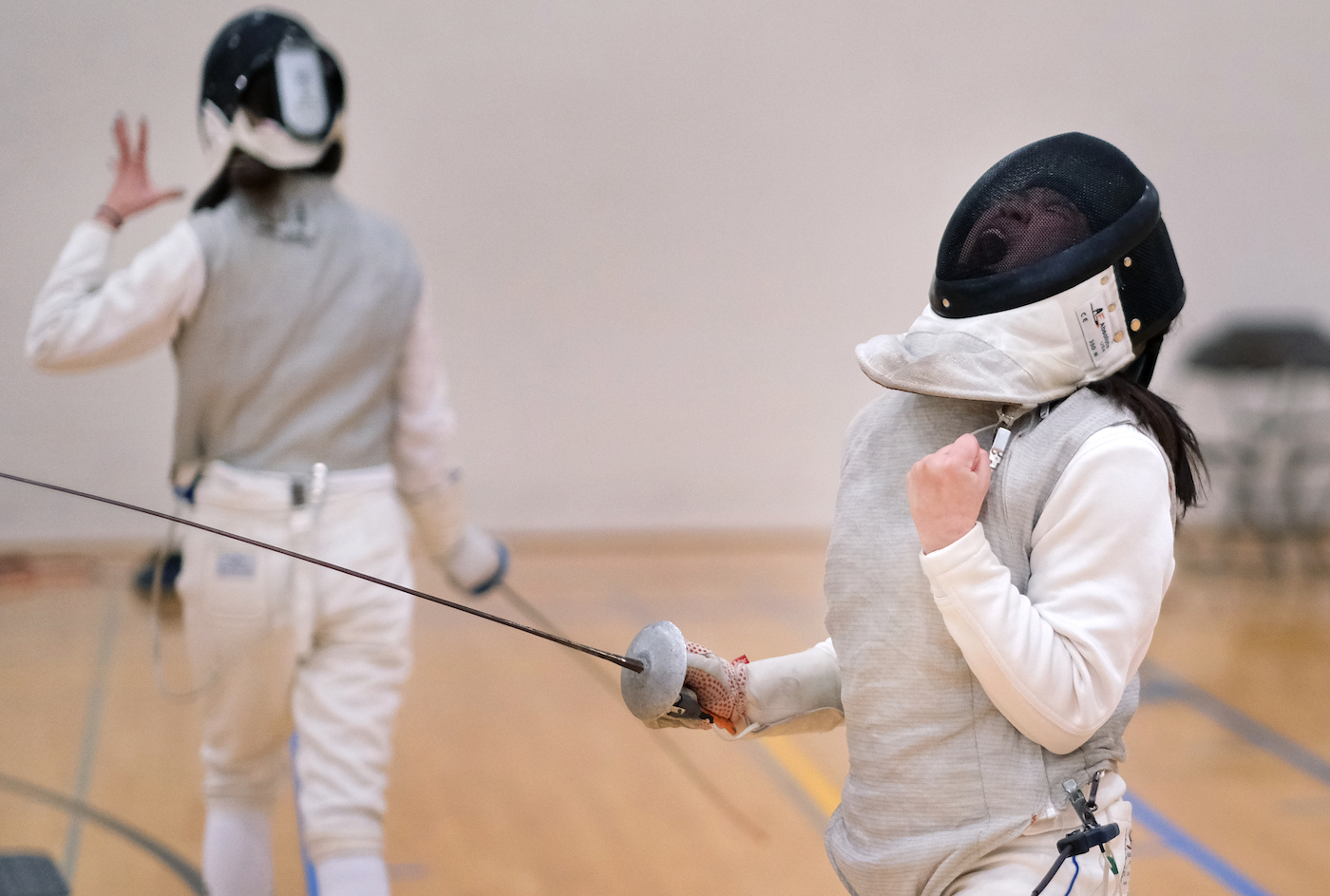 Sophie Kelley, a first-year women's foil, reacts to a win in a meet earlier this season.