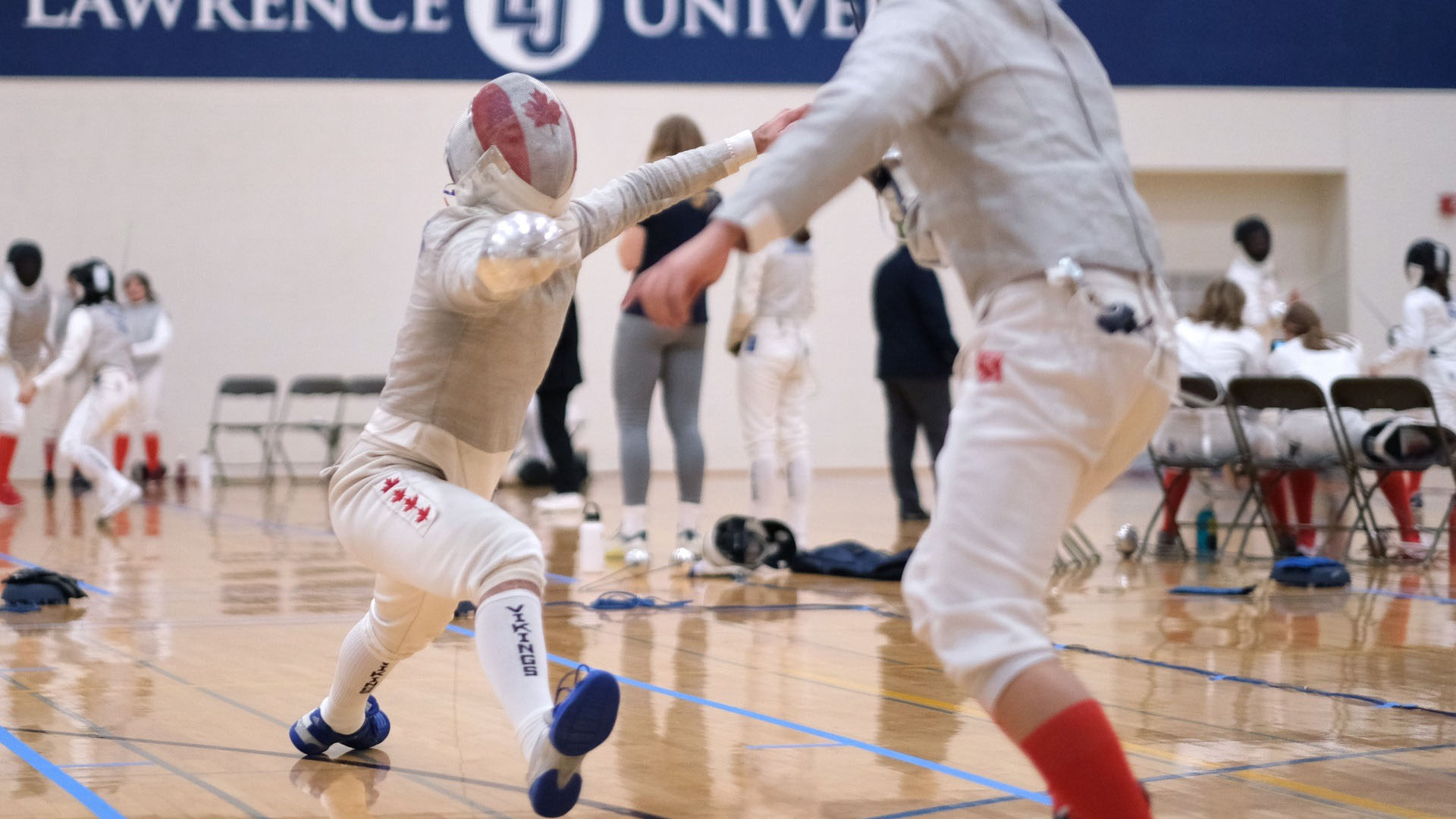 Jordan Diacos '26 fencing in Alexander Gym