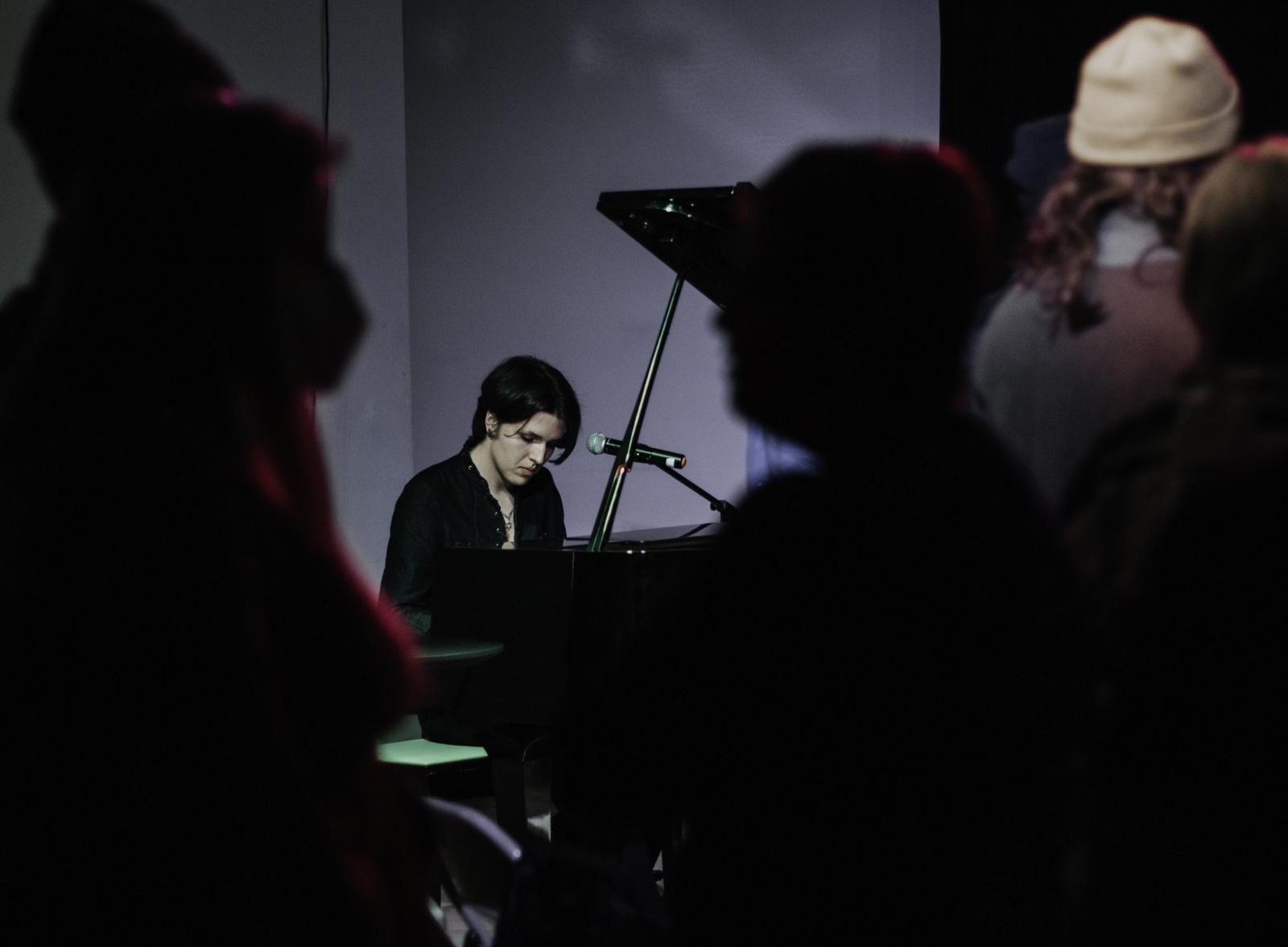 Miri Villerius plays the piano and dancers fill the dance floor during Klezmer on Ice., 