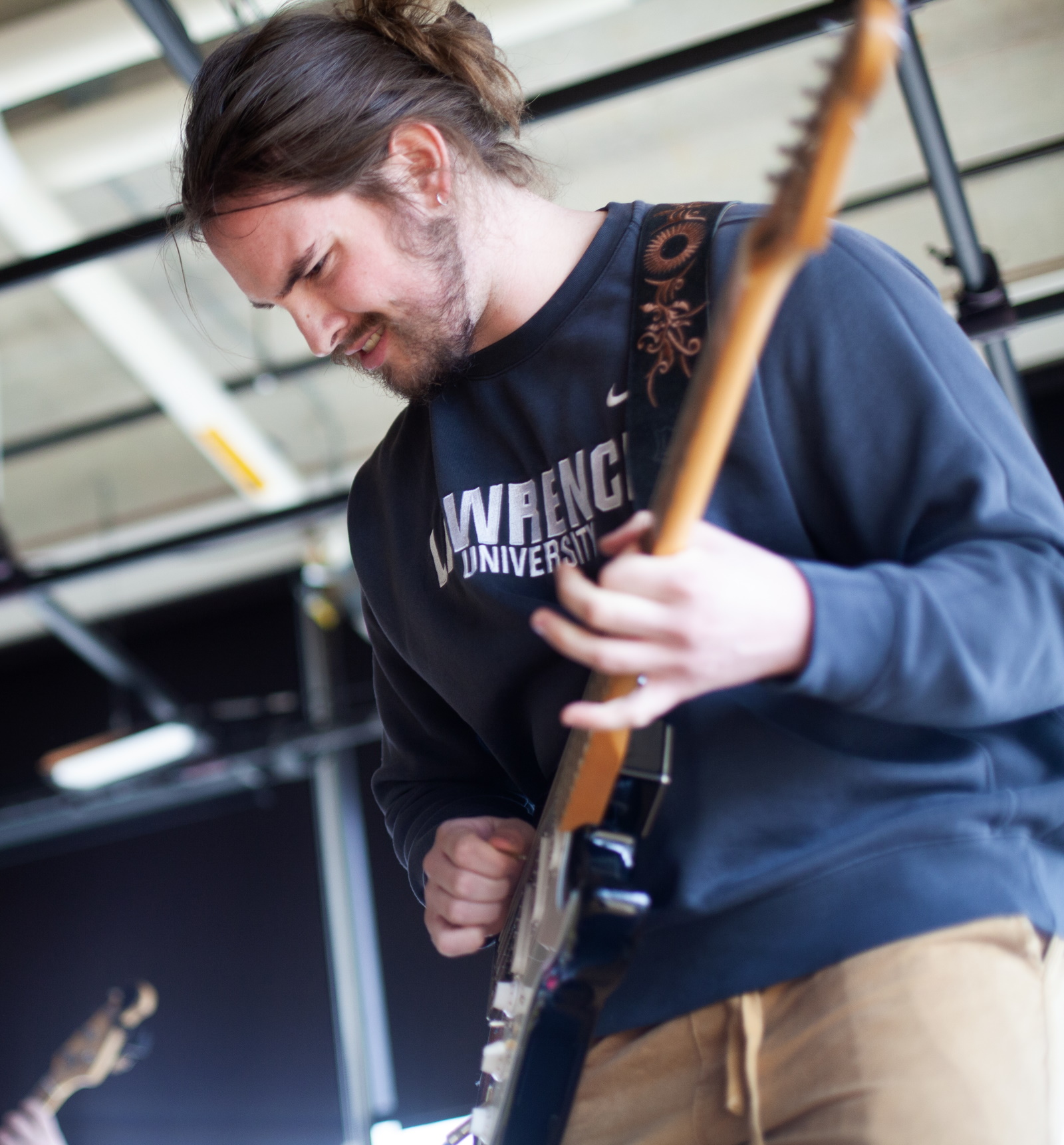 Michael Murphy performs at EarthFest in Warch Cinema. Students like Michael who are business and entrepreneurship majors and music performance majors, study entrepreneurship in college, and earn a business and entrepreneurship degree, while building their own business. (Photo by Danny Damiani)