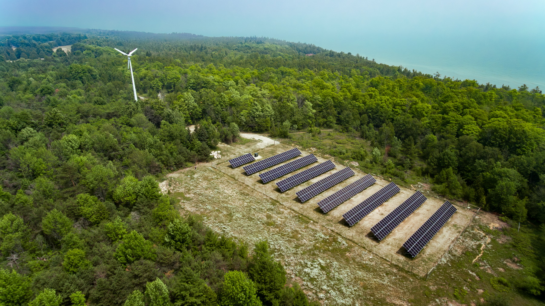 The solar array and wind turbine are seen from above.