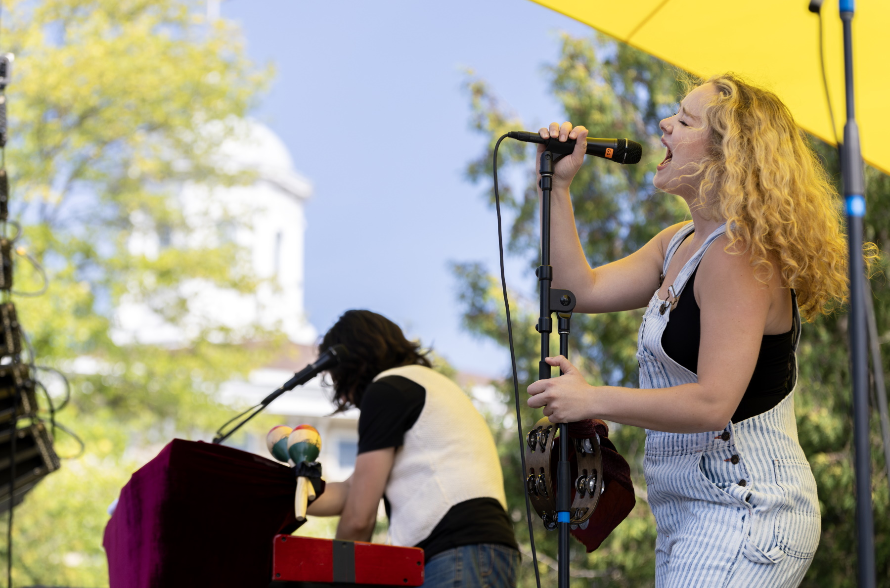 The band Heavy Heavy performs on the stage set up on Main Hall Green.