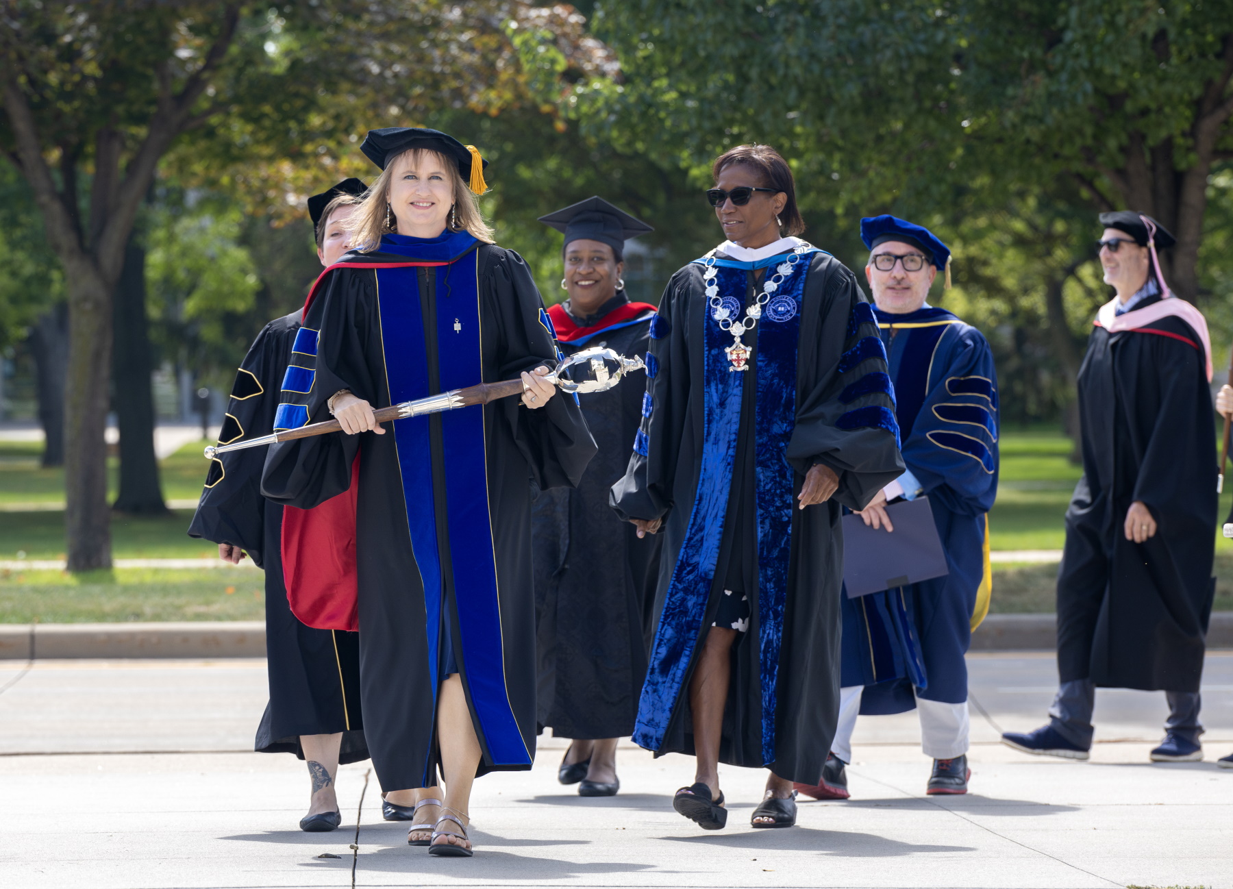 Faculty marshal Celia Barnes leads President Laurie Carter and members of the faculty into Memorial Chapel for the Matriculation Convocation.