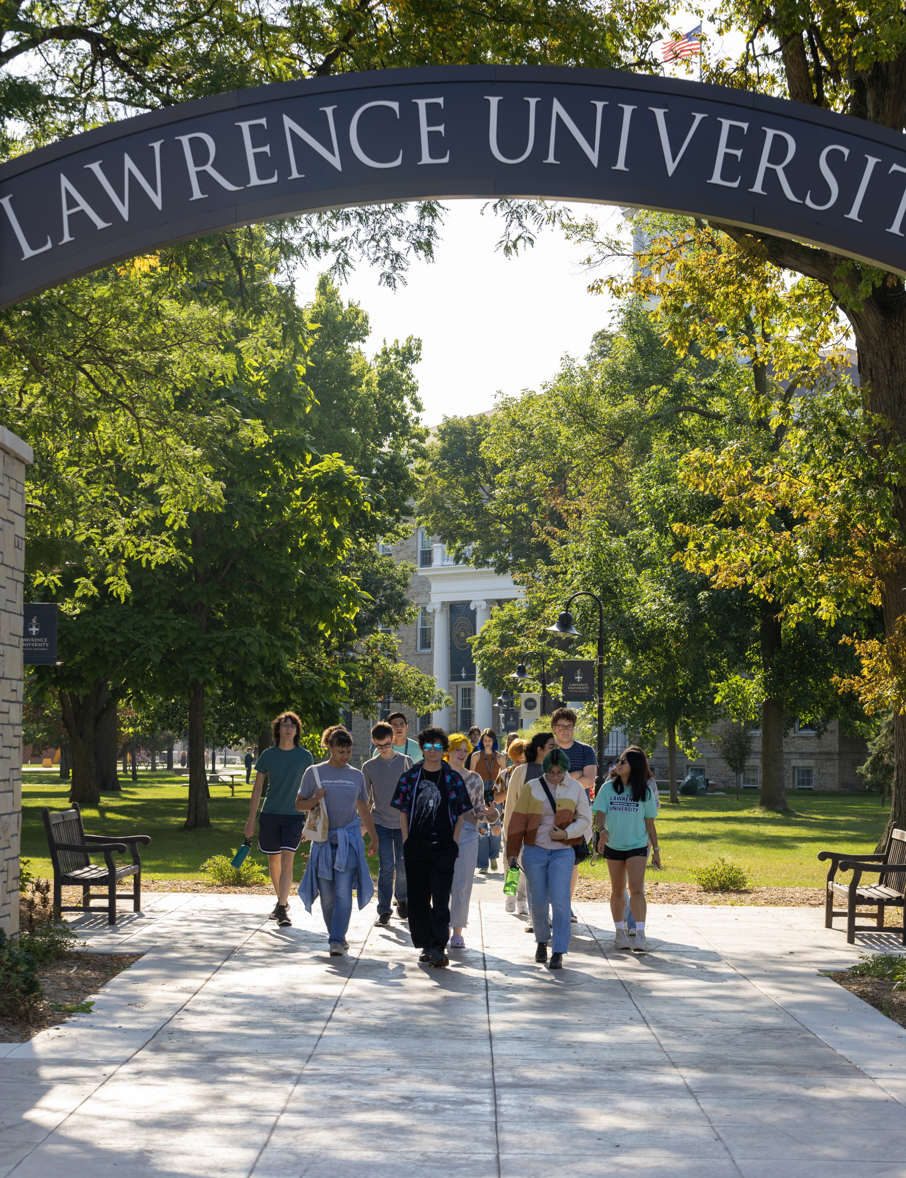 Incoming students walk beneath the Lawrence Arch during Welcome Week.