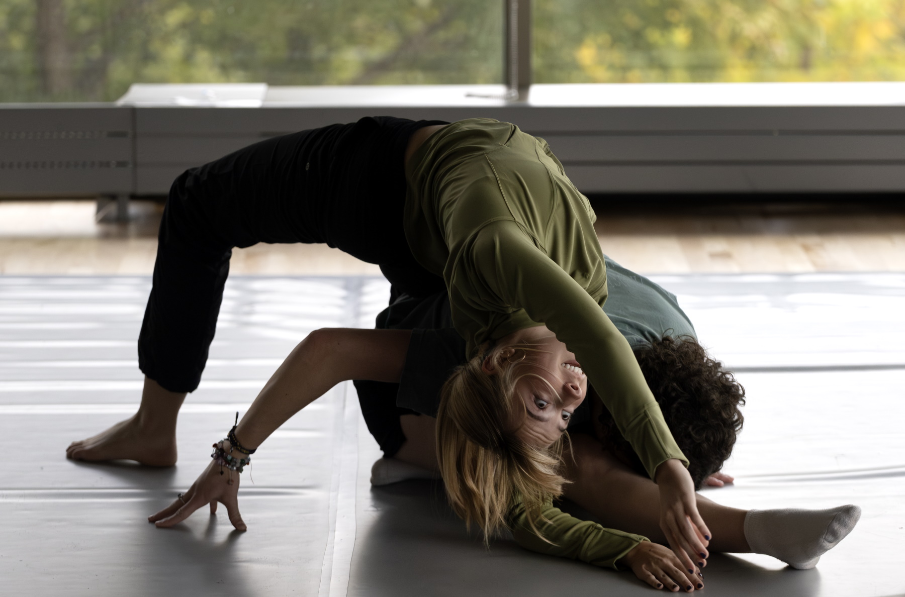 Tori Schneider (left) and Madeleine Tevonian take part in Dance Collective Ensemble class at Lawrence. 