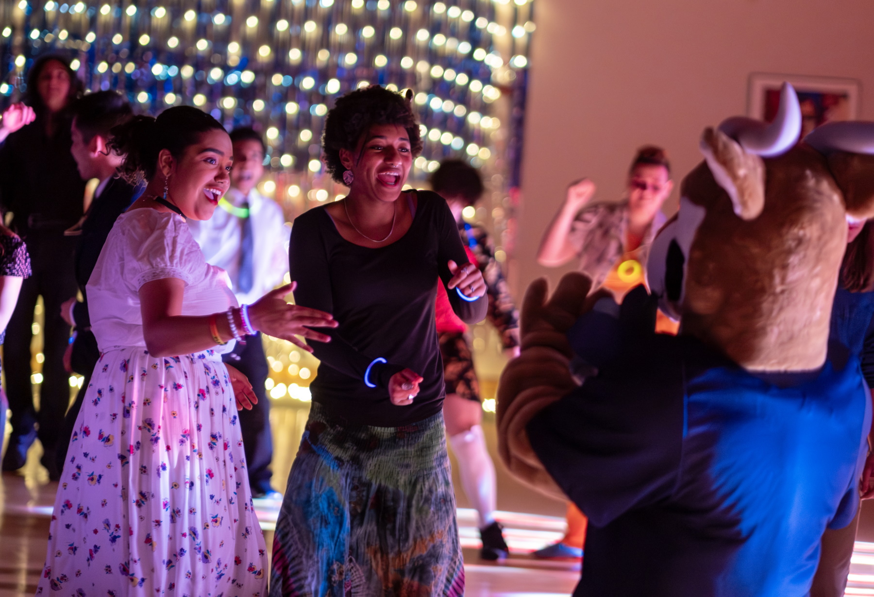 Students dance with Blu during the Homecoming Dance in Warch Campus Center.