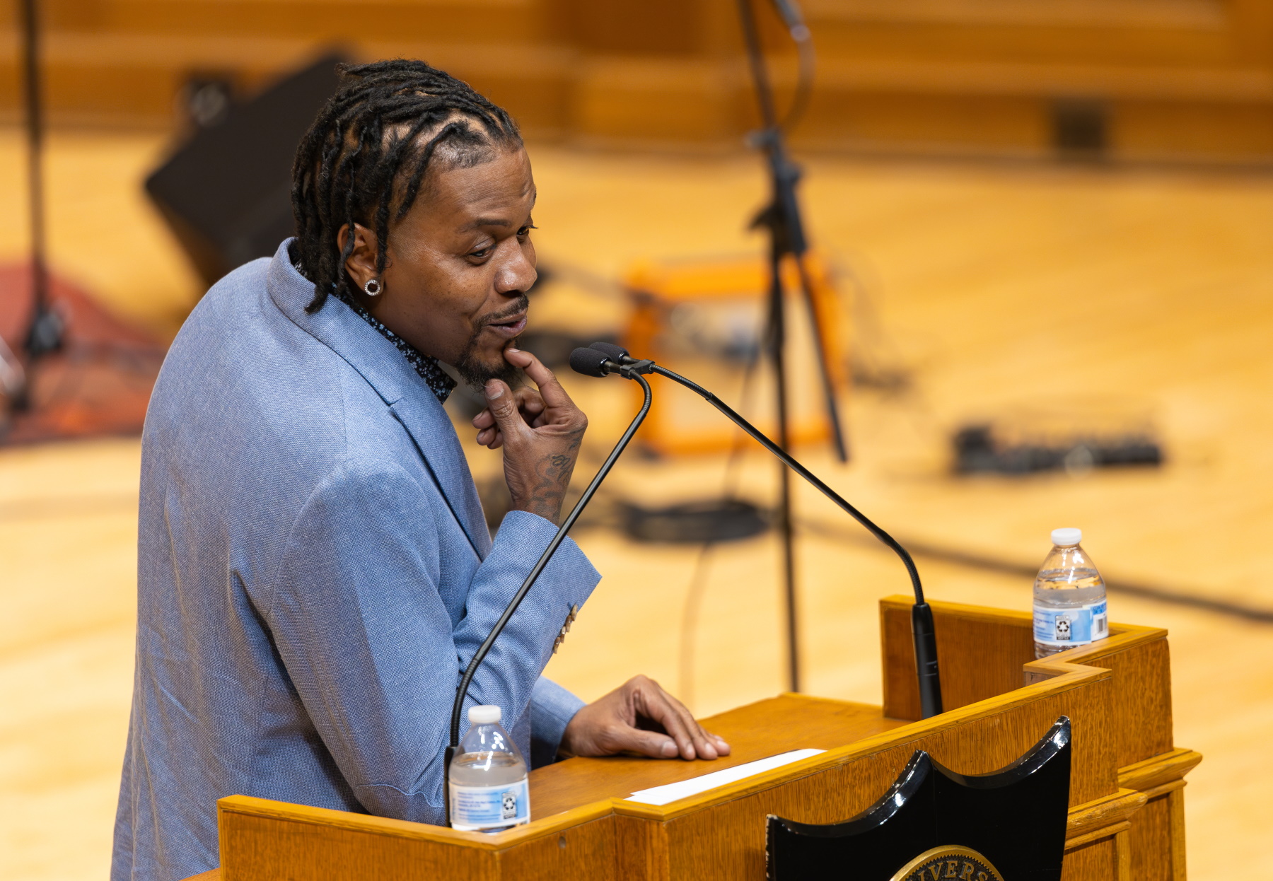 Cainan Davenport delivers the keynote address from the podium on the stage of Memorial Chapel.