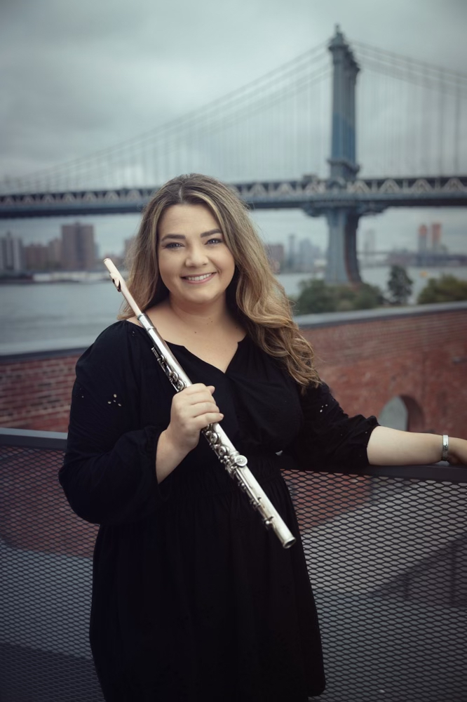 Schuyler Thornton '14 holds her flute as she poses for a photo. 