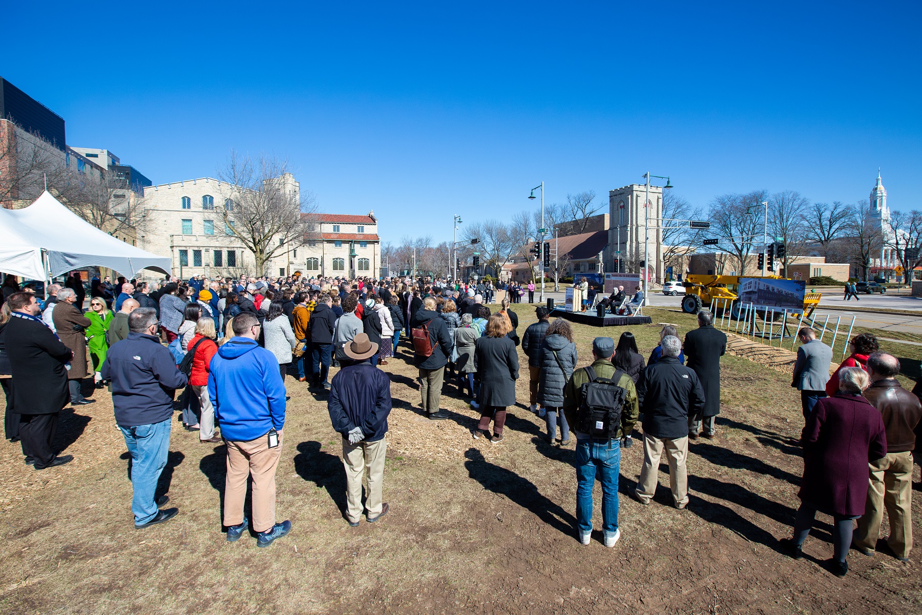 A crowd of more than 200 gathers for the groundbreaking.