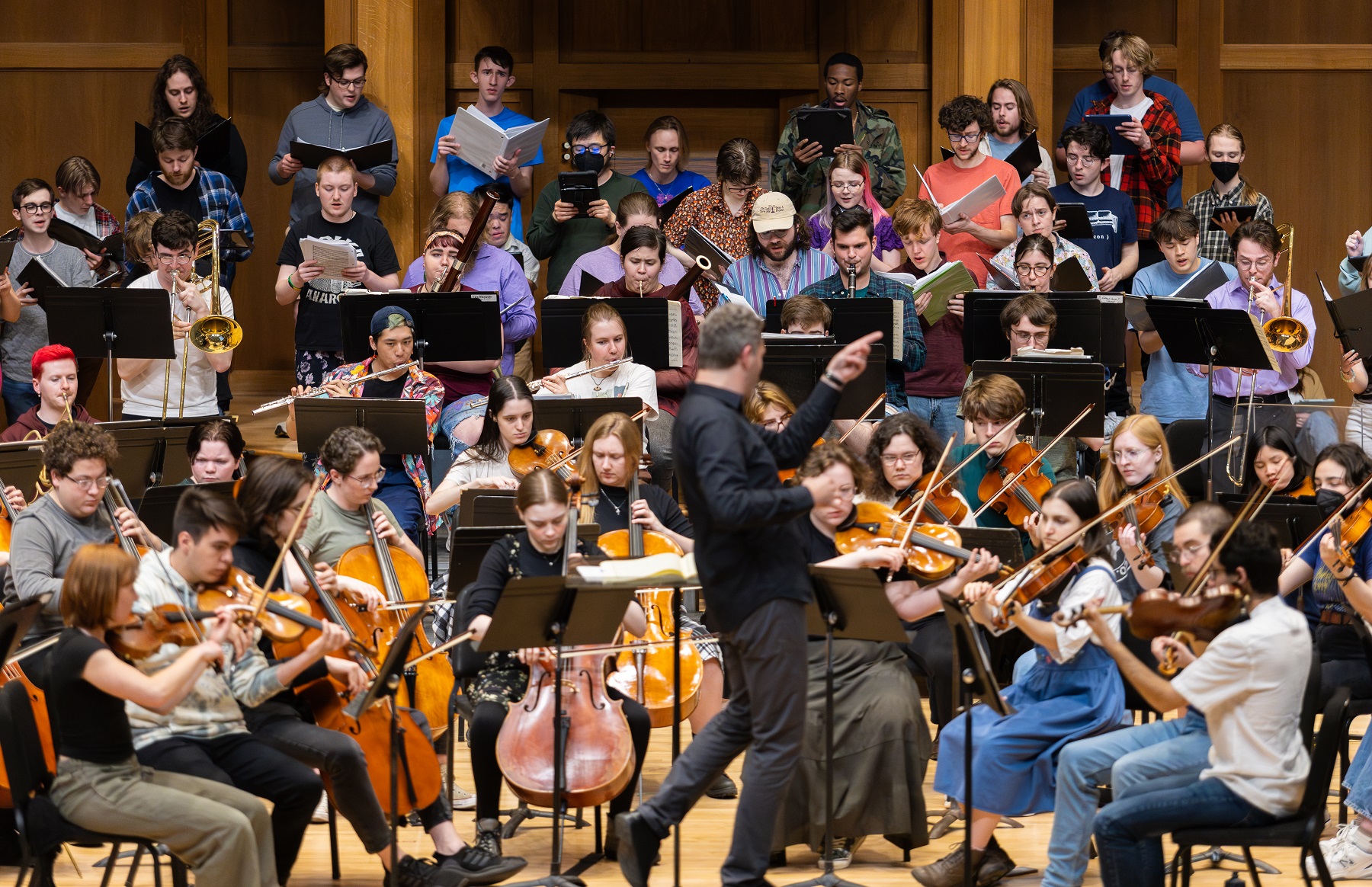 Led by Mark Dupere, Lawrence students rehearse on stage in Memorial Chapel for the April 19 Major Works Concert.