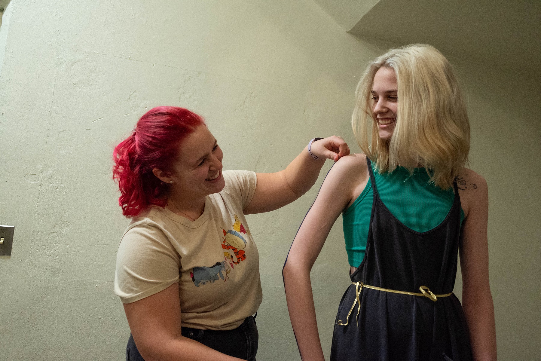 Jordan Wallin-Swanson works with sophomore Aimsley Shearer, both theatre majors, in the costume shop.