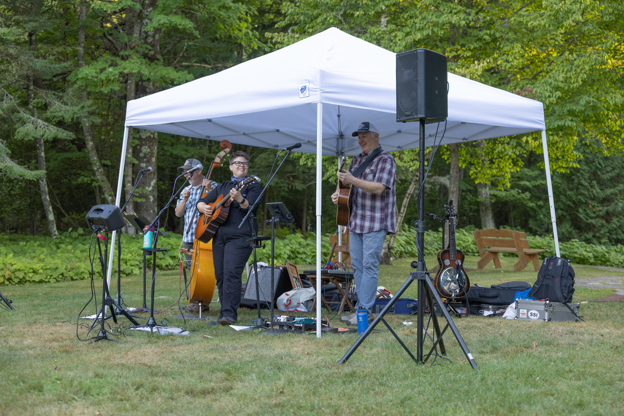 Katie Dahl's band frolics under a tent for Concerts by the Lake.