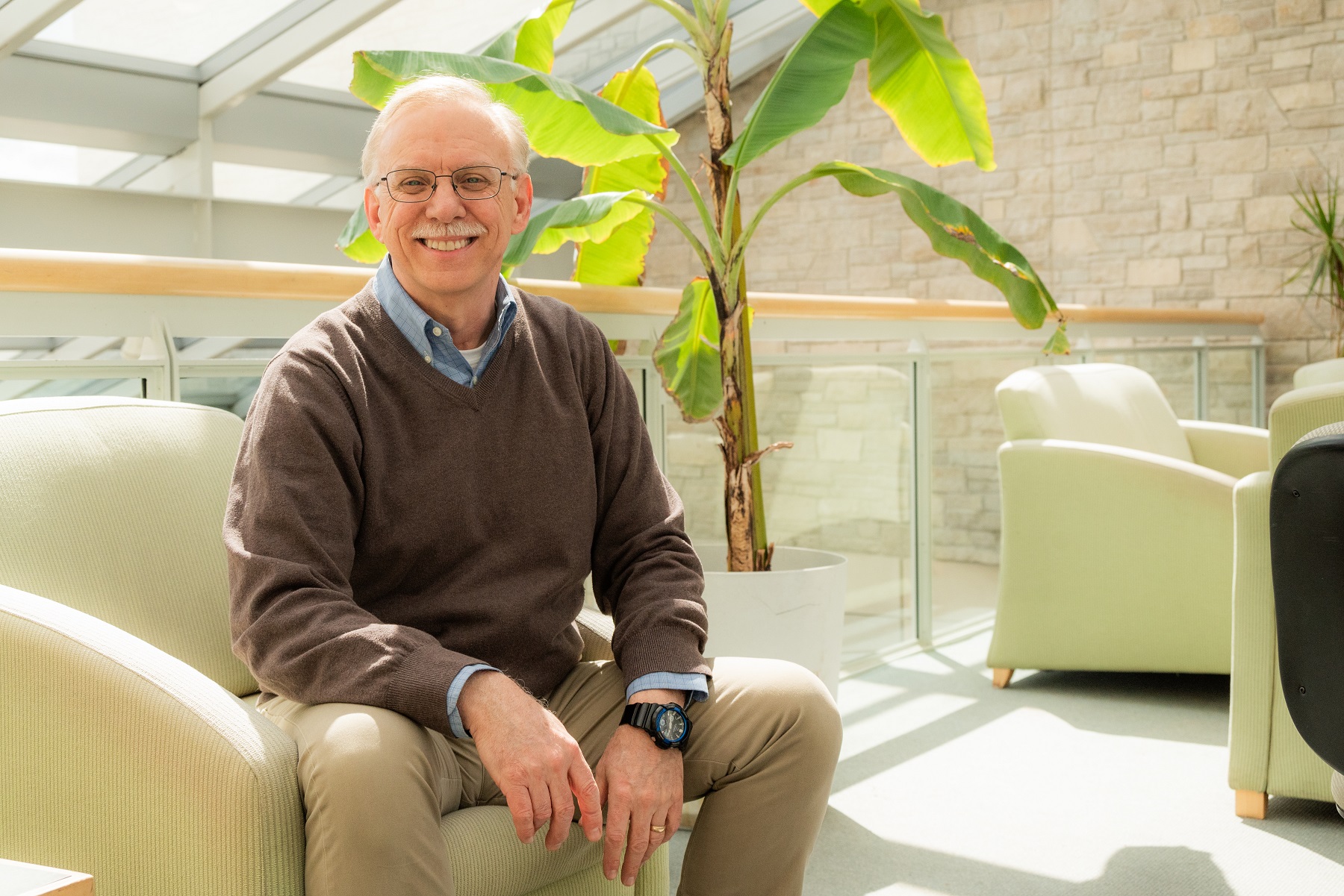 Bart De Stasio poses for a photo in the Steitz atrium.