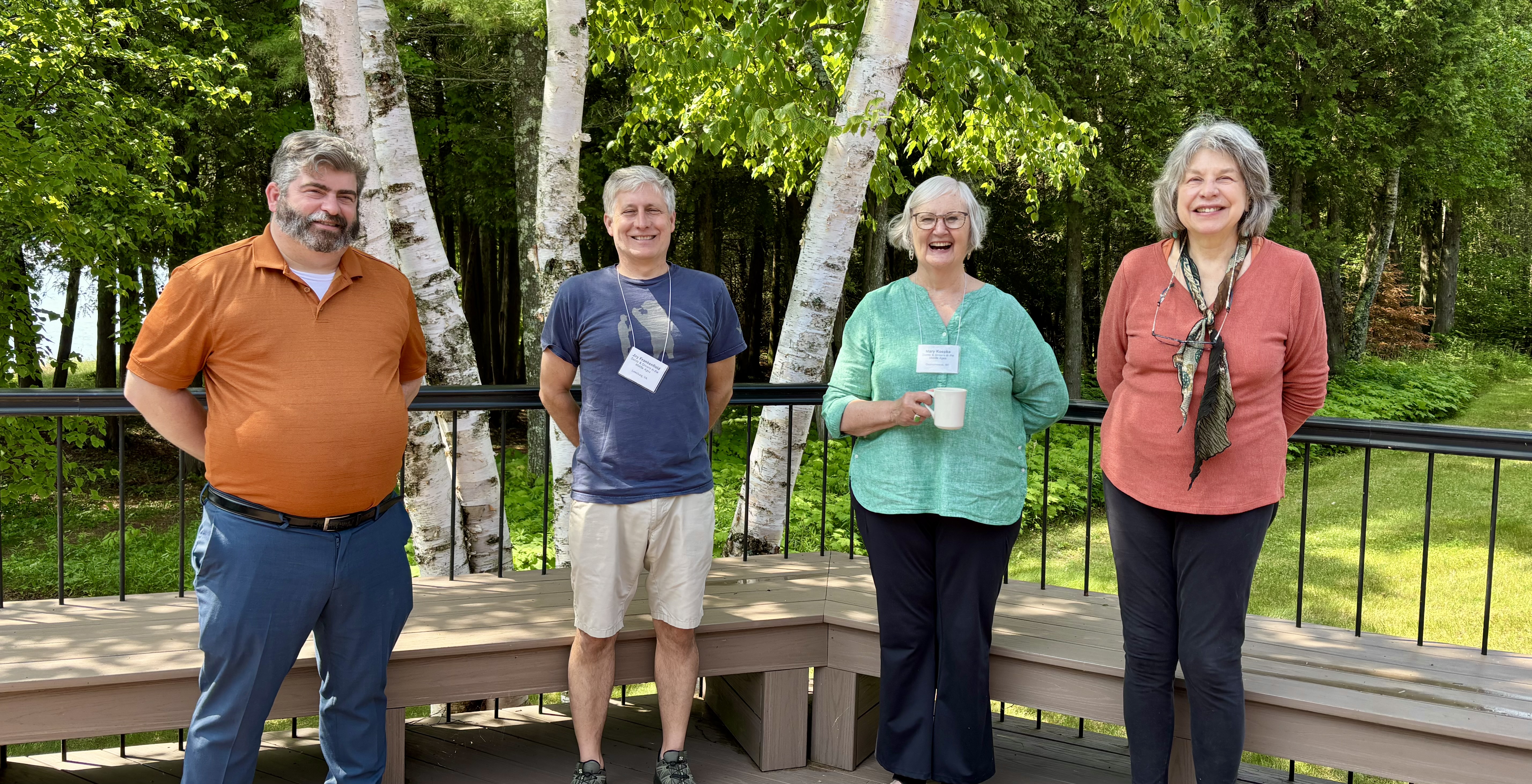 Saints and Sinners in the Middle Ages pose on the deck.