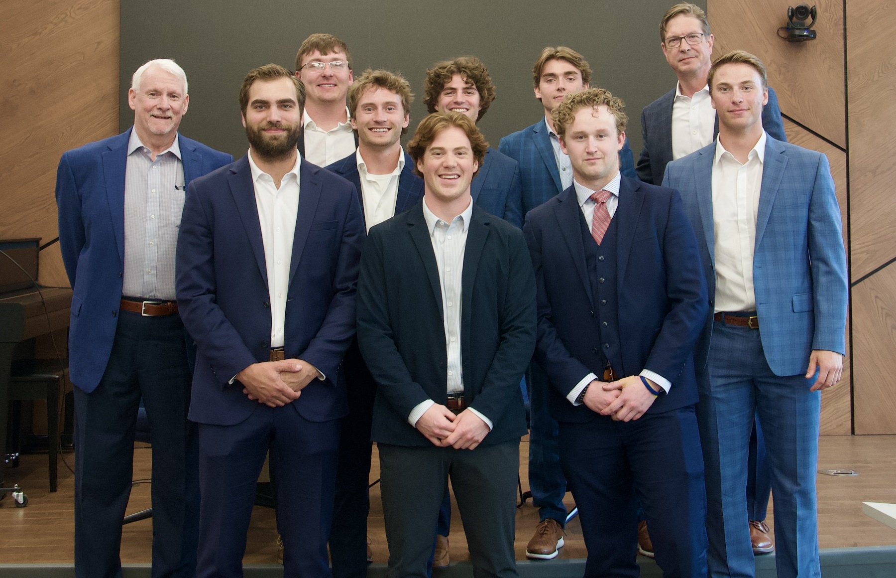 Tim Thompson ’78 (far left) and Dean DuMonthier ’88 (second from right) led students through an investment pitch in the B&E Center. The students included (from left) Jayden Jensen, Jacob Stanley, Ethan Beaumont, Carter Cloutier, Patrick Noonan, Cody Brekke, Joseph "Jeb" Dee, and Evan Izenstark.