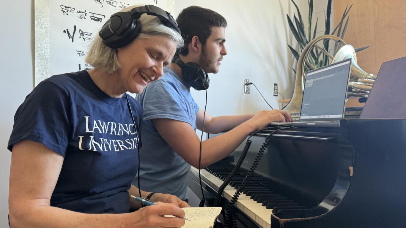 Student and faculty member edit music