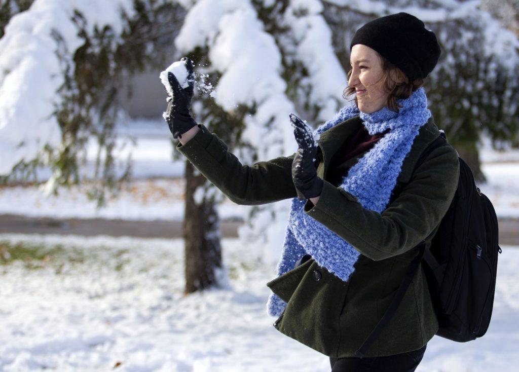Olivia Sibbet '23 tosses a snowball as she plays in the snow on the Lawrence campus.
