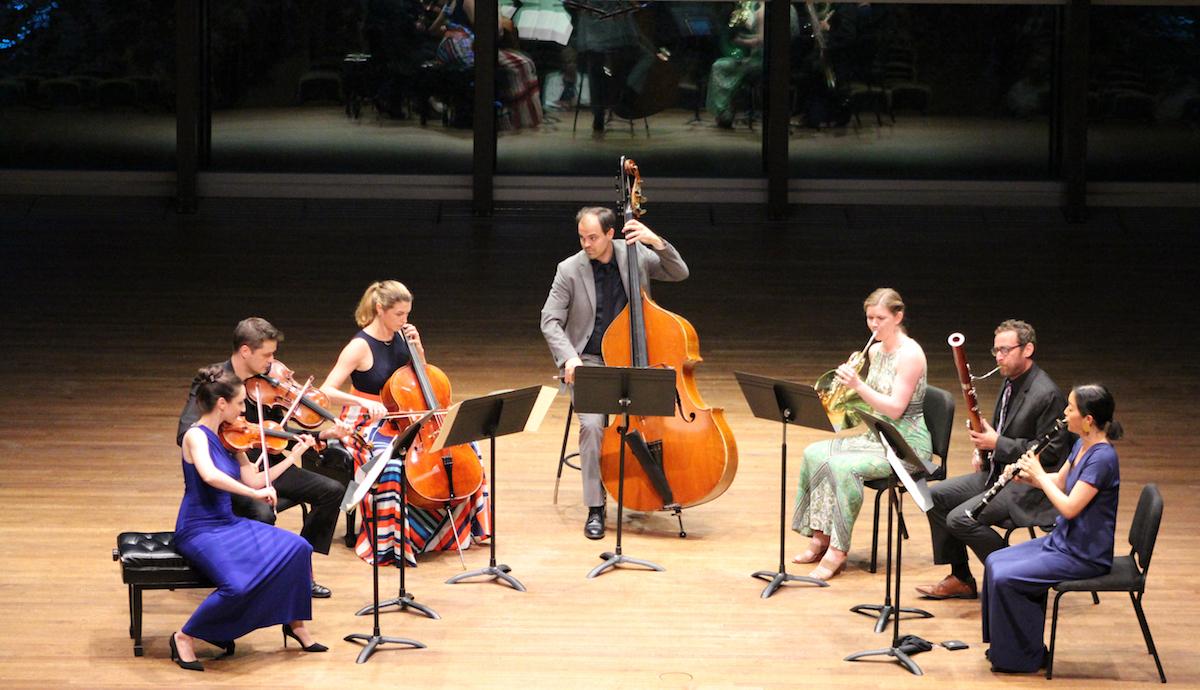 Musicians performing on a stage  