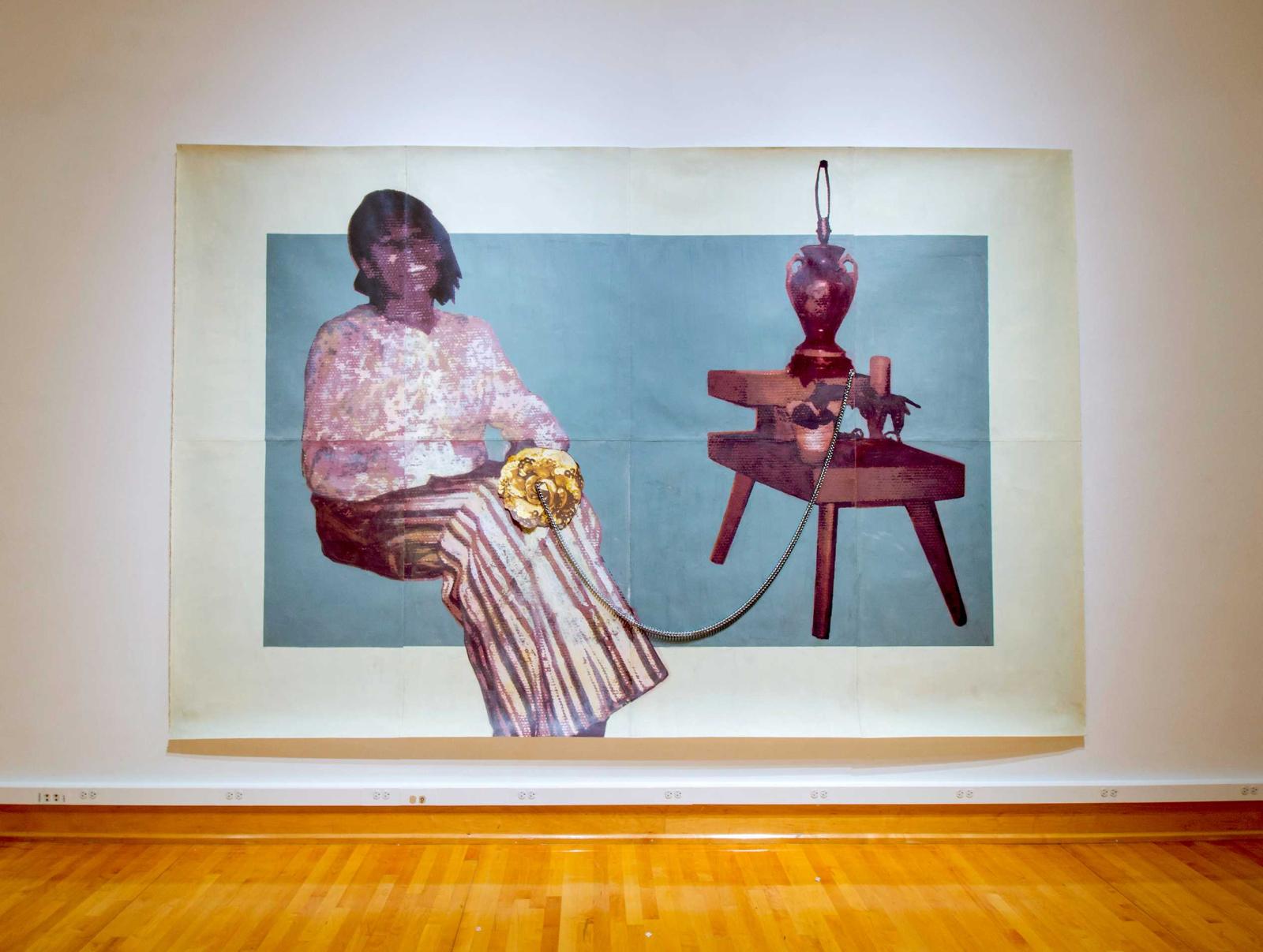 Artwork featuring a seated woman holding a large gold flower on the left and a side table with lamp and plant on the right. The woman and table are connected with a silver cord. 