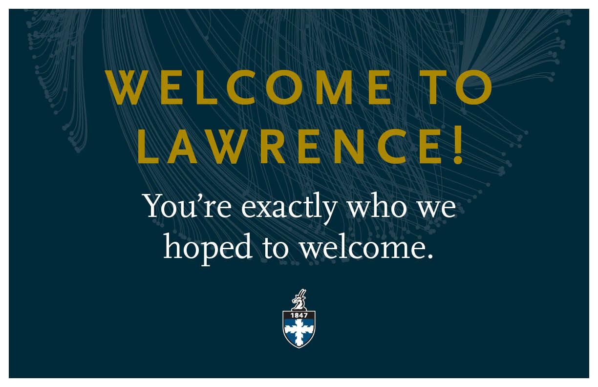 Blue poster with text, "Welcome to Lawrence! You're exactly who we hoped to welcome."