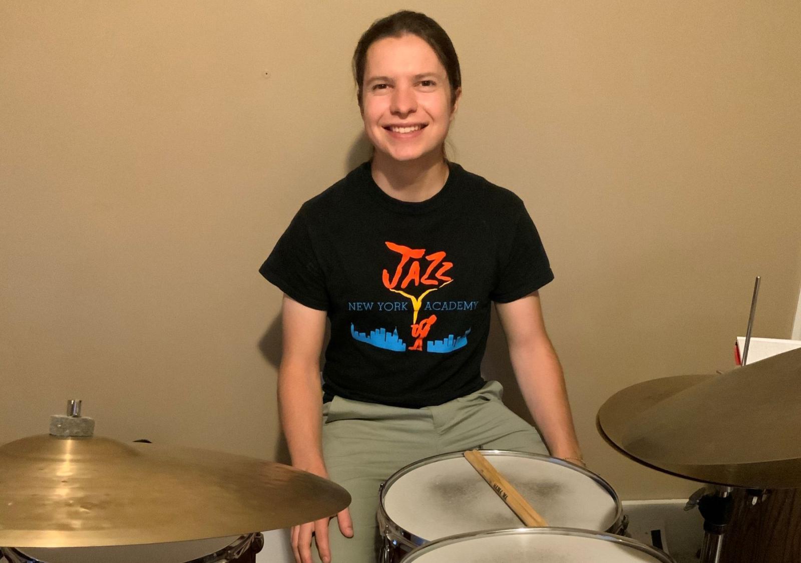 Nolan Ehlers '20 posing in front of drums