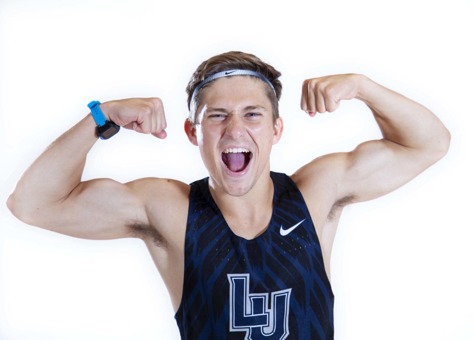 Cross country runner Adam Bruce shows off his biceps