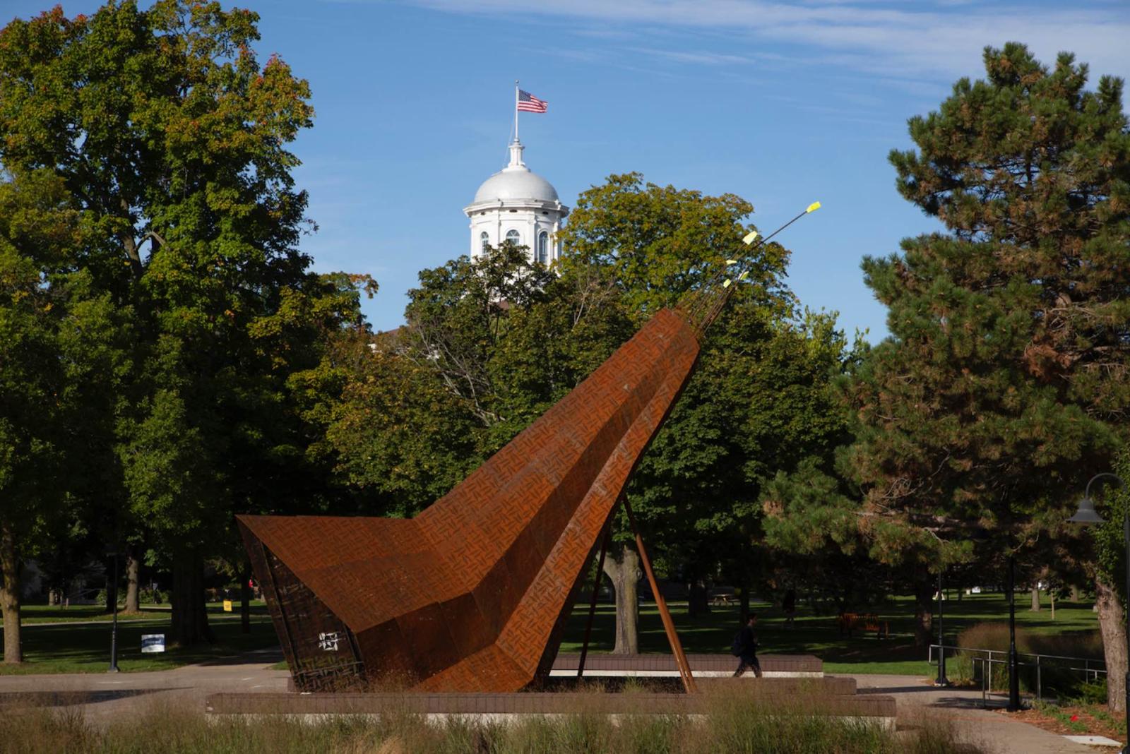 Otaeciah, crane sculpture with Main Hall's cupola peaking out in background.