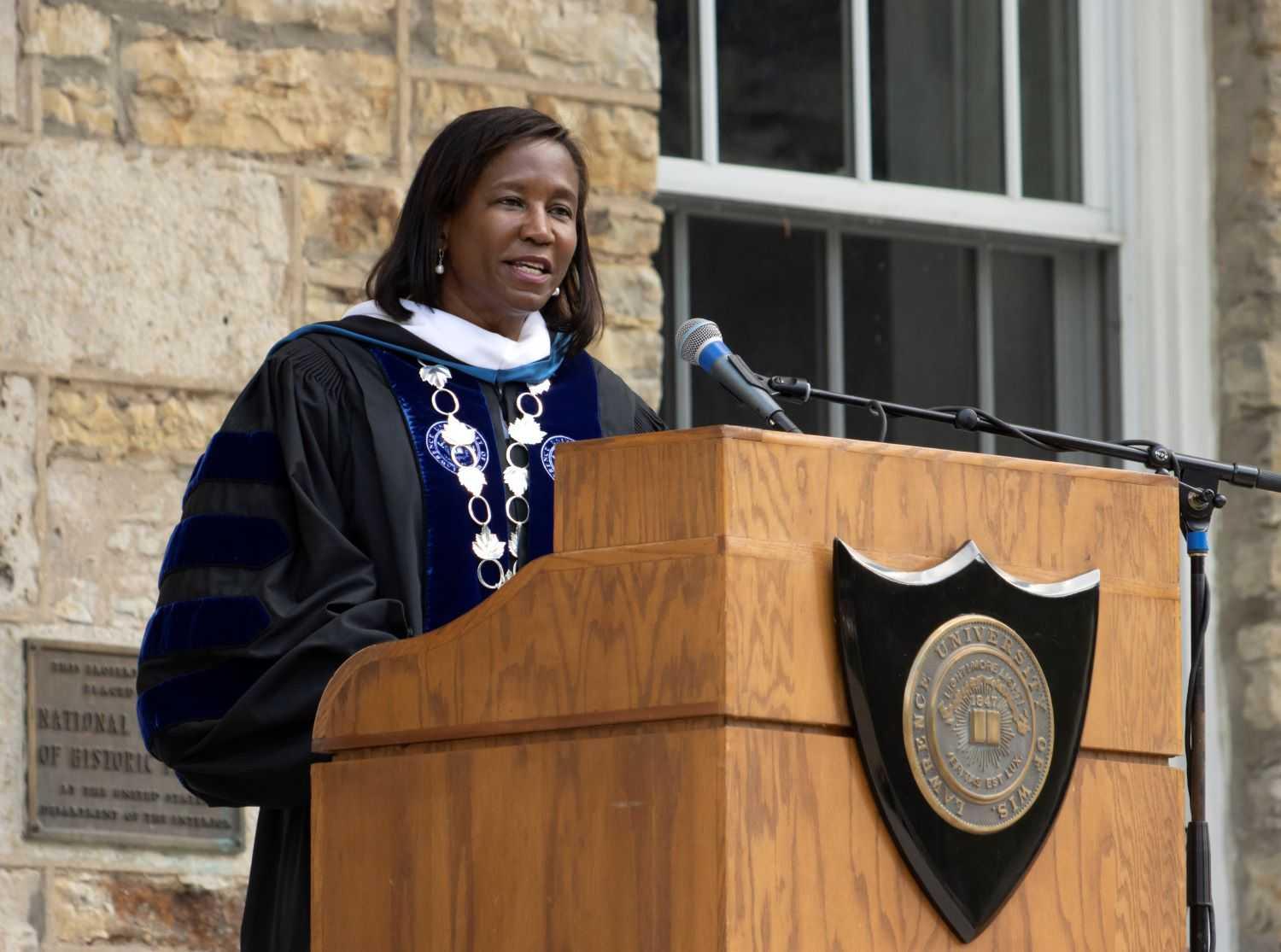 President Laurie Carter speaks to new students and their families in front of Main Hall.