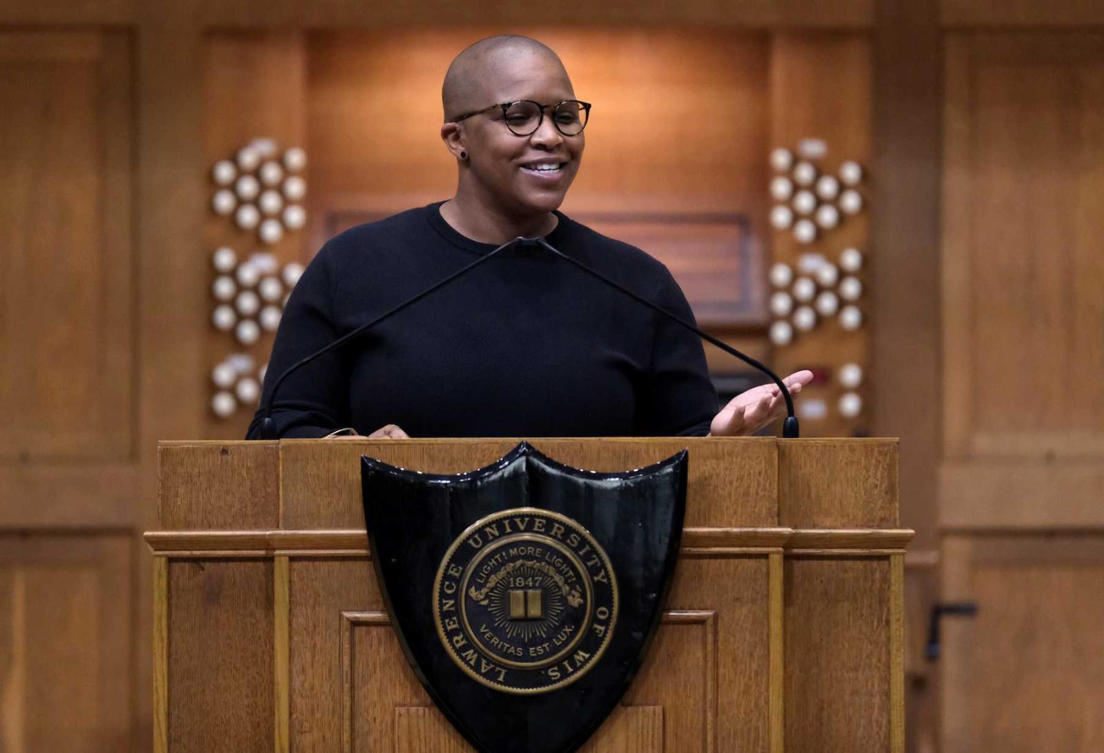 Alexandra Bell stands at the podium on the stage of Memorial Chapel as she delivers her convocation address.