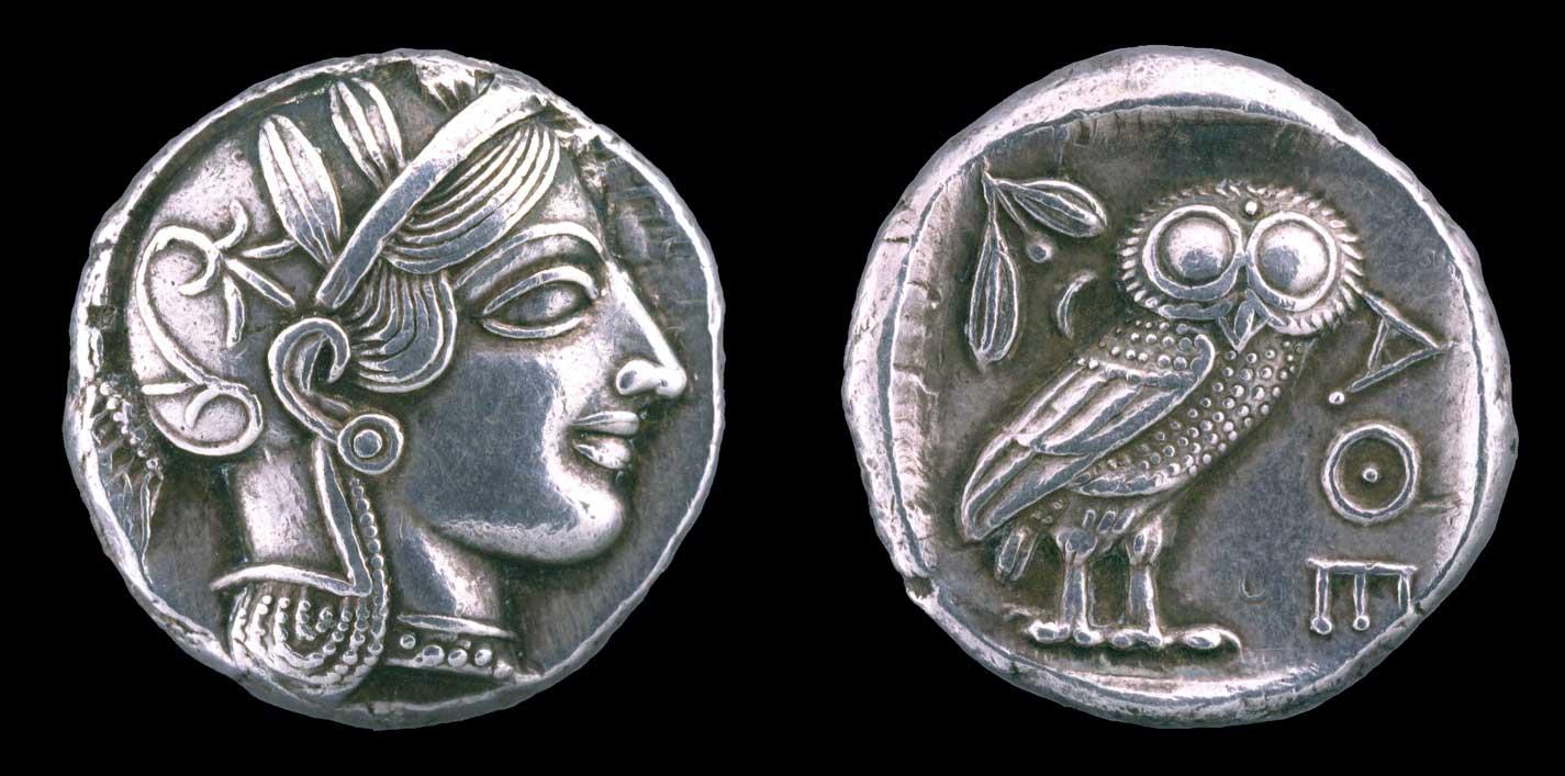 Two sides of a silver coin: head of Athena facing right, wearing helmet with laurel leaves (left) and wide-eyed owl, olive leaves, berry, Greek letters for Athens (right)