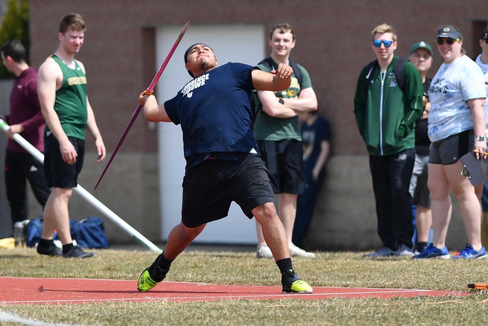 Ian Thomas launches the javelin during a meet.