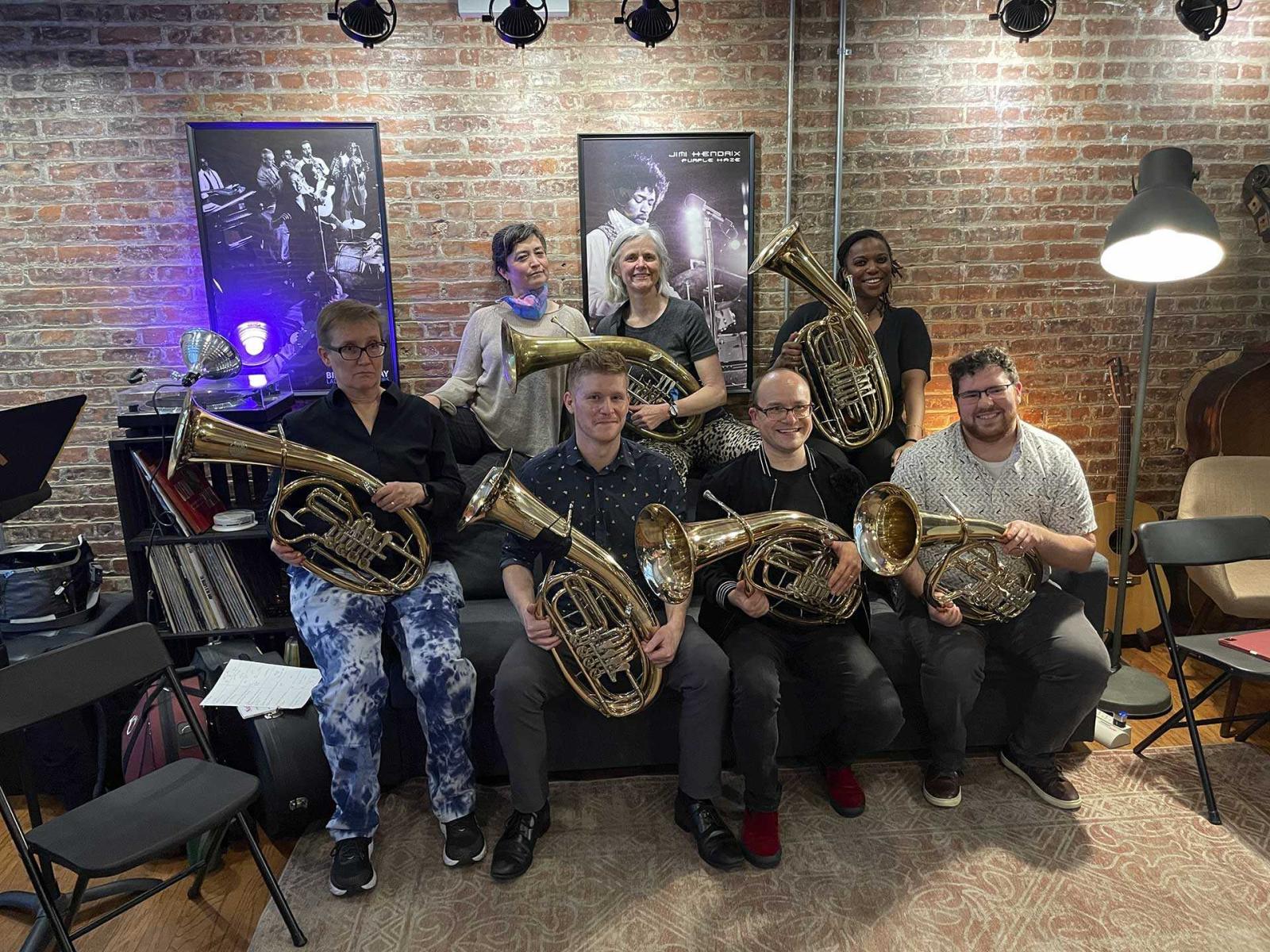 The Lawrence Graduate Bayreuth Tuben Quintet poses for a photo with their Wagner tubas.