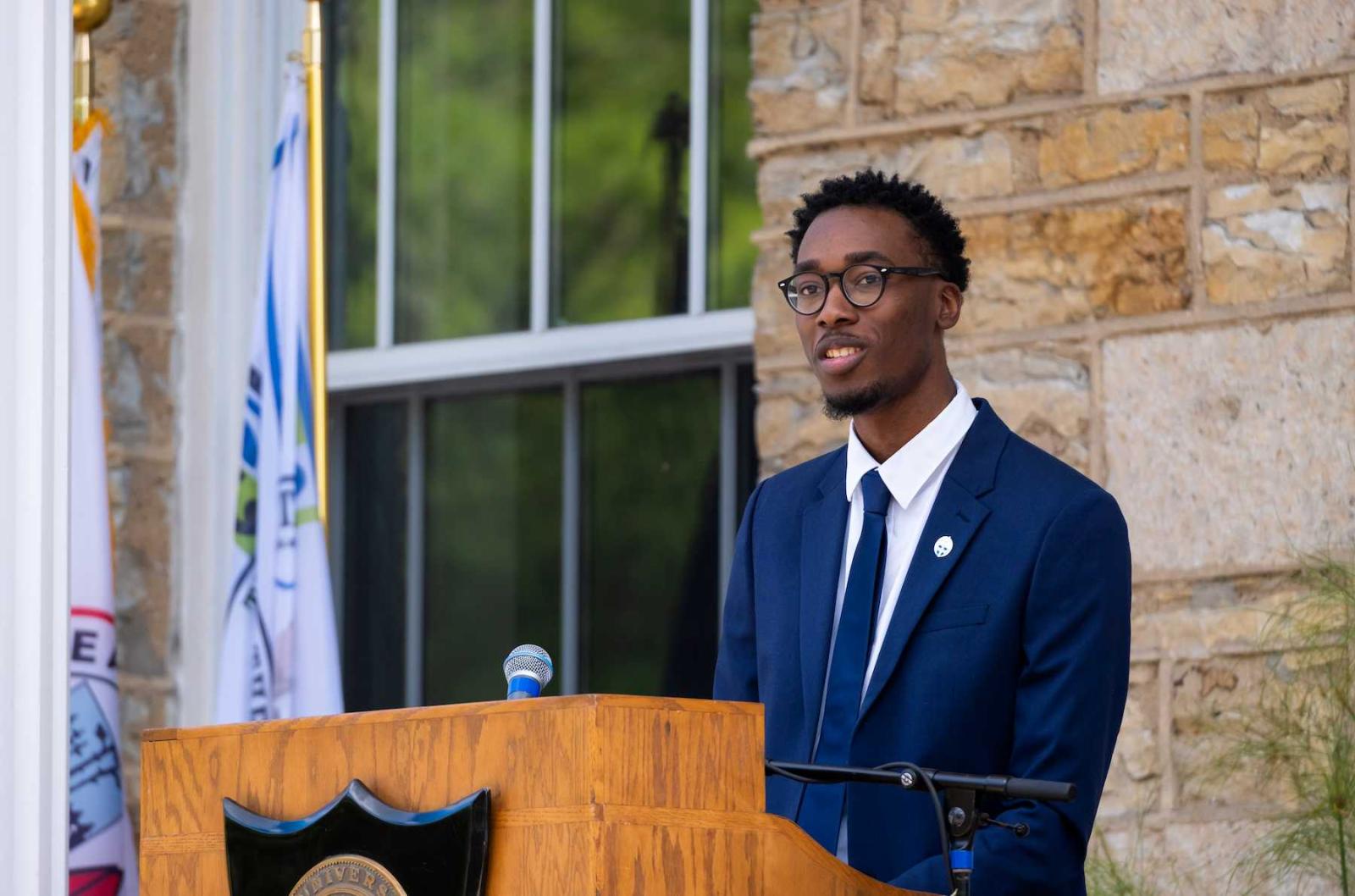 Malcolm Davis speaks from the steps of Main Hall at the 2022 President's Welcome.