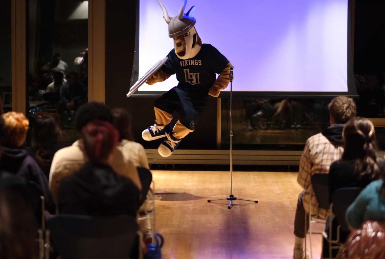 The antelope mascot performs on stage during the student talent show.
