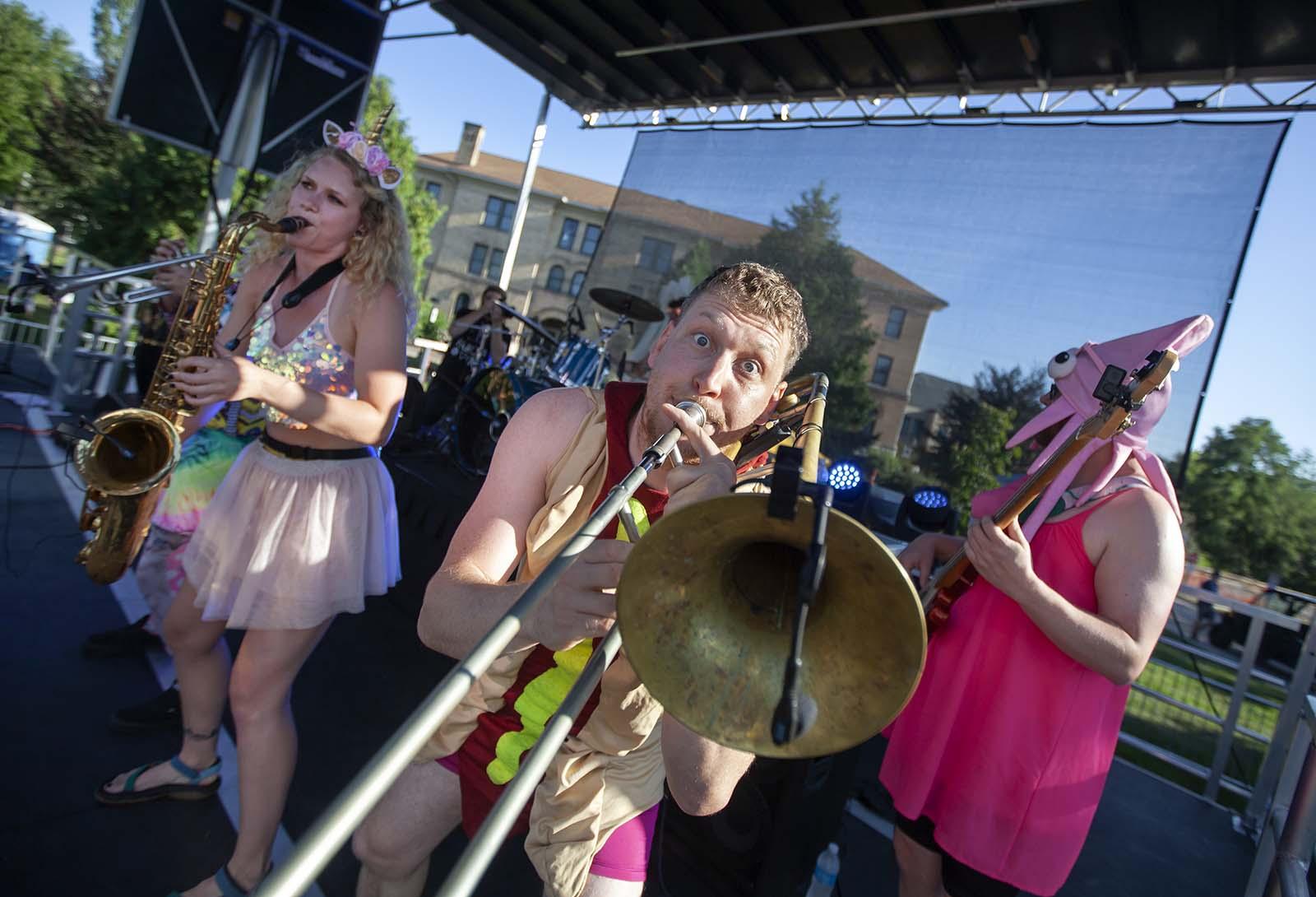 Members of Porky’s Groove Machine perform at the Lawrence University stage during Mile of Music.  
