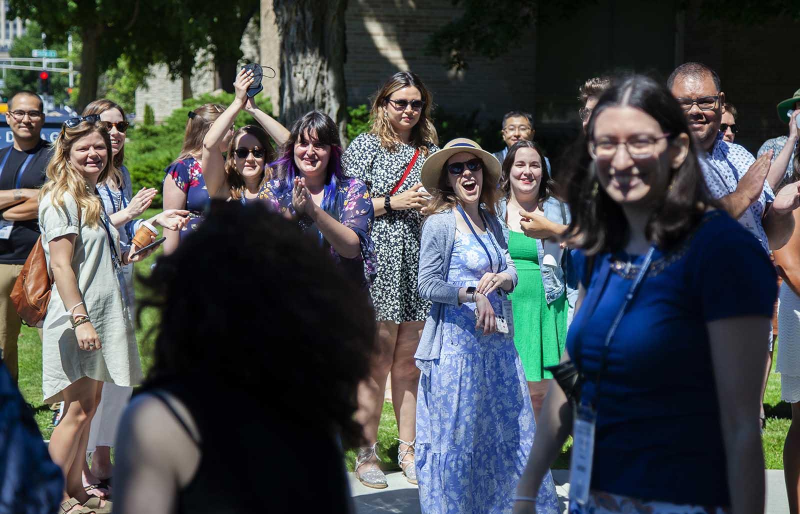 Alumni cheer for other graduates of Lawrence University during The Parade of Classes at Reunion. 