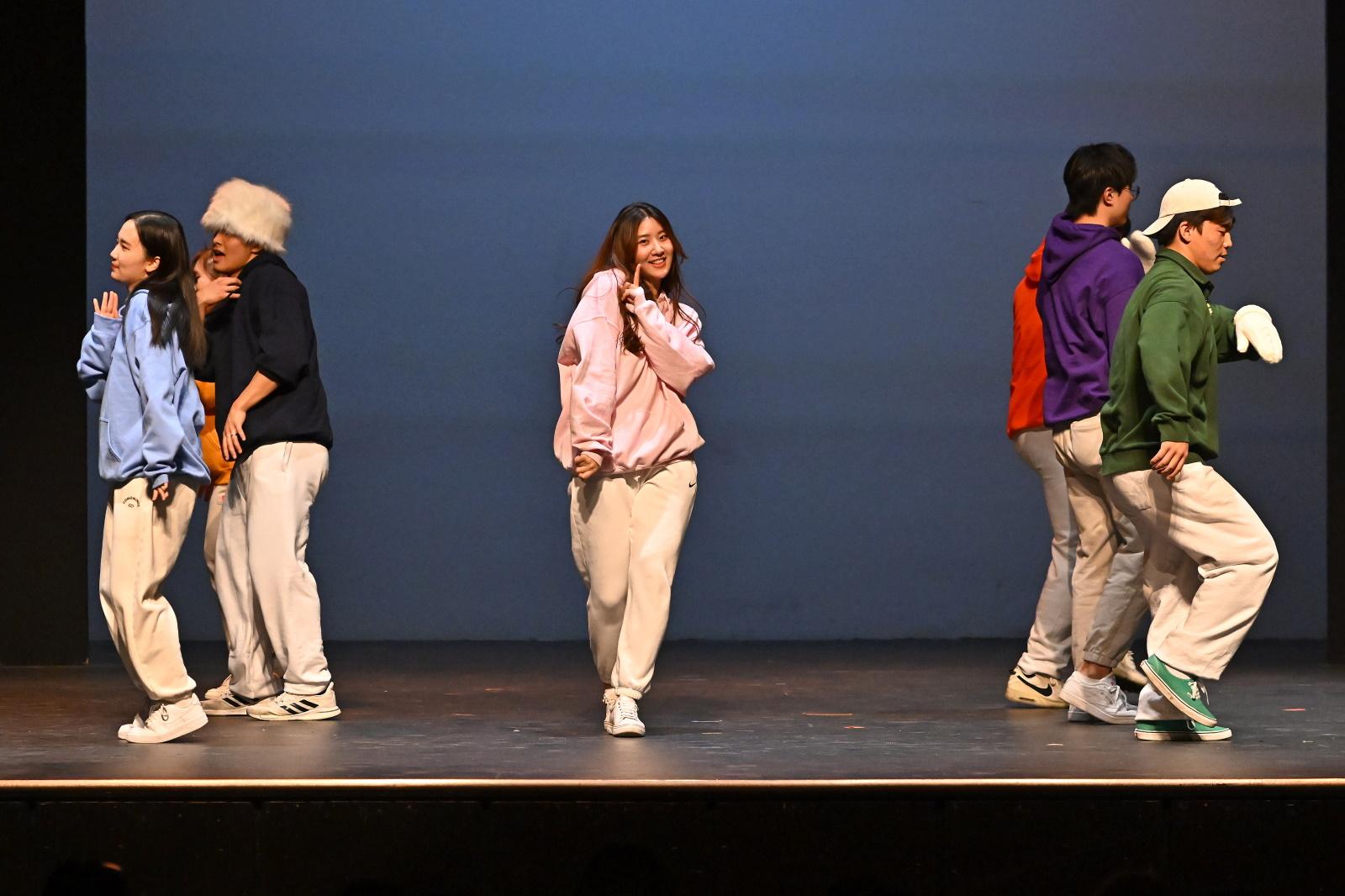 Seven students dance during a Cabaret performance.