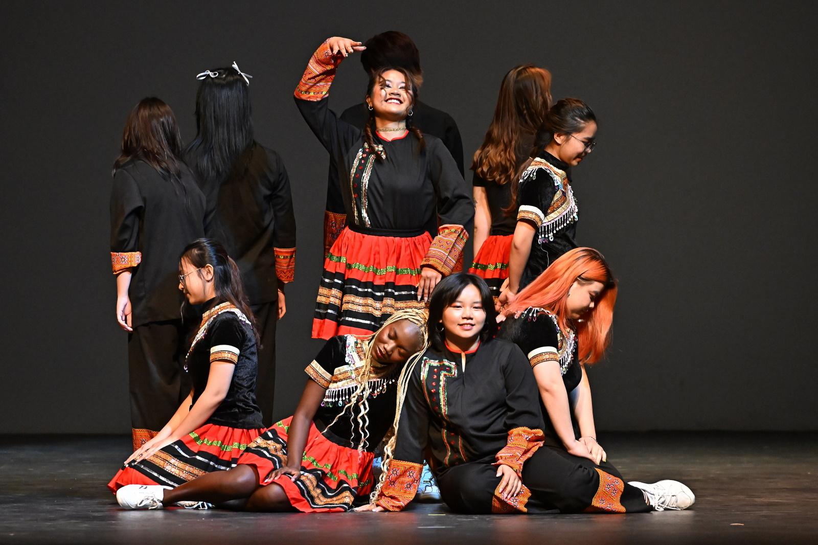 Nine students finish a dance routine during Cabaret.