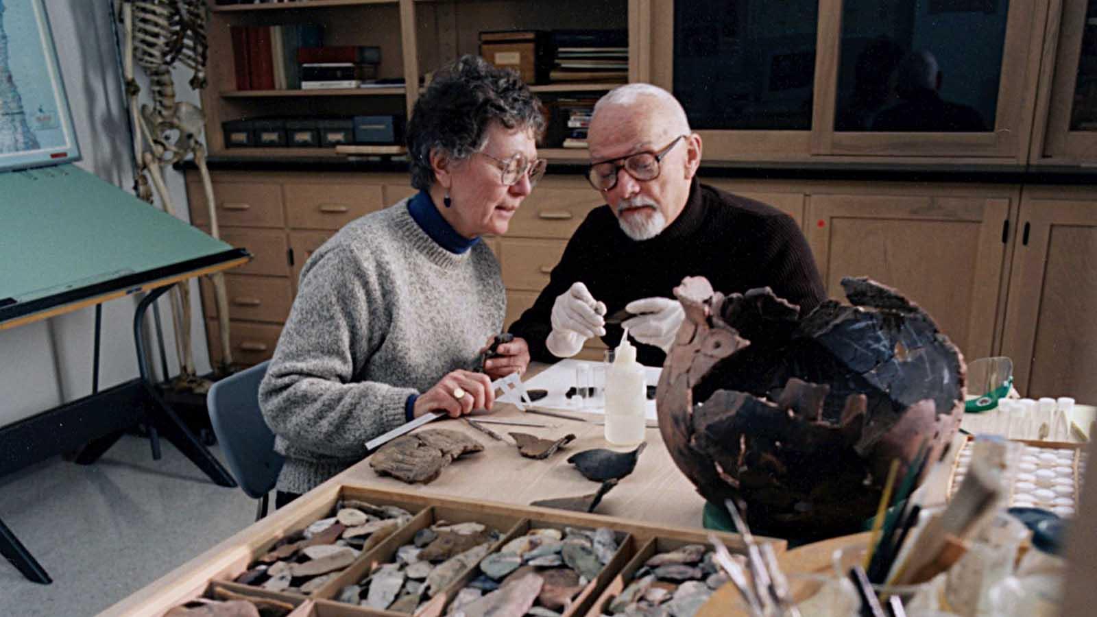 Ron and Carol Mason engaged in study of anthropological specimen