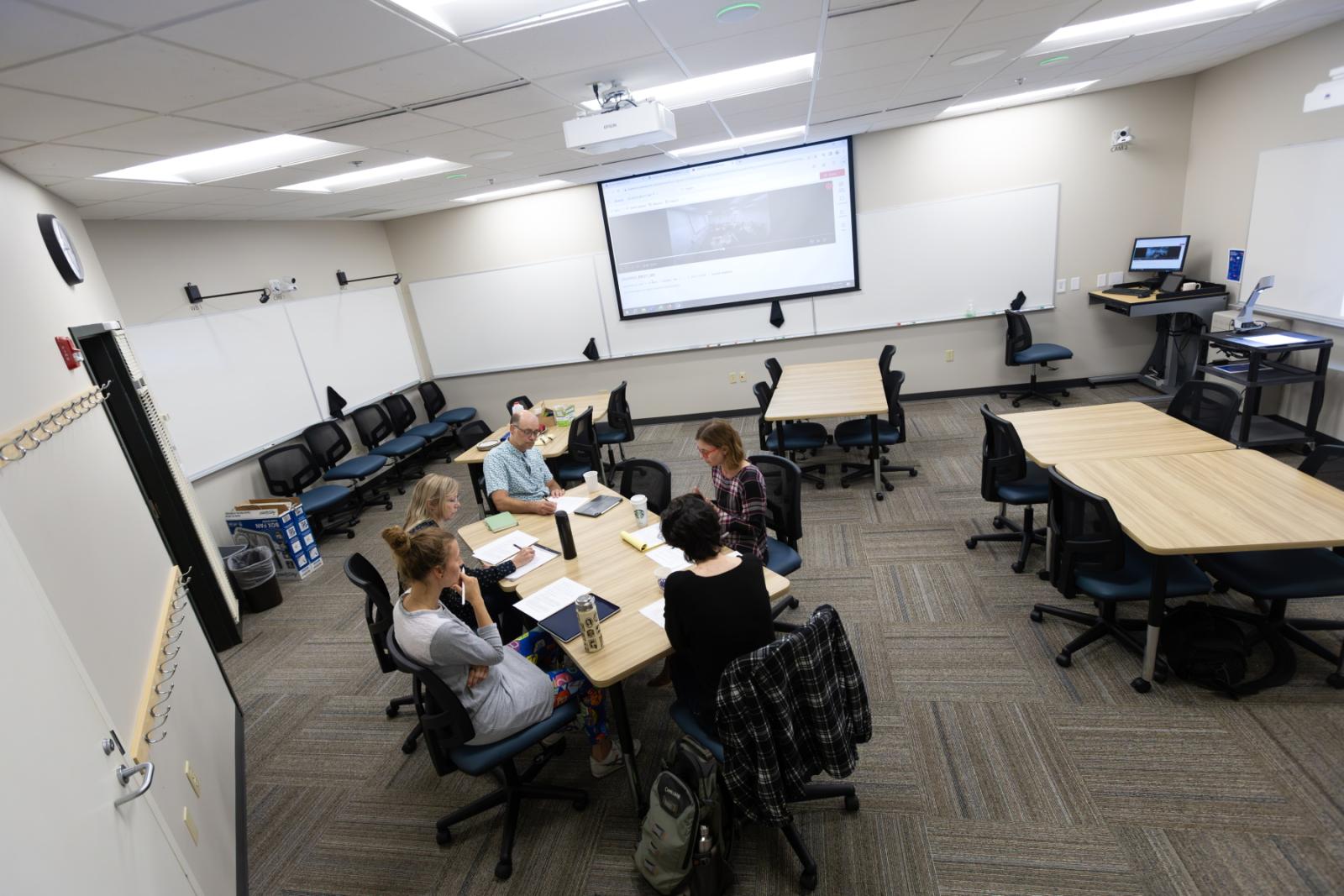 Stephanie Burdick-Shepherd leads a group of Lawrence faculty in discussion in the Center for Teaching Excellence classroom in Briggs Hall.