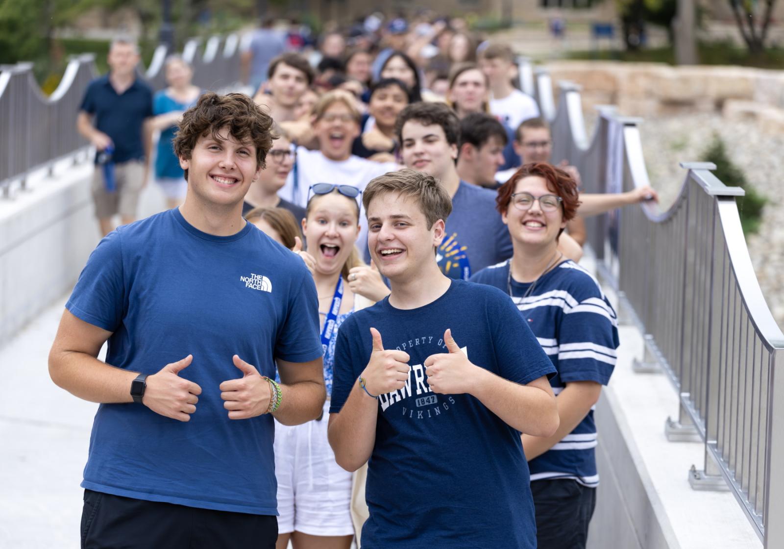 New students lined up on the walking bridge before making their way to the Lawrence Arch to begin Tuesday's procession.