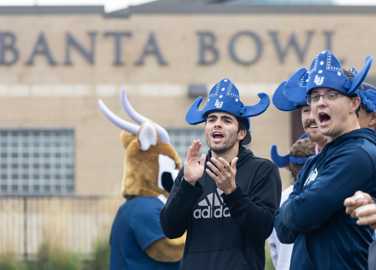 Students cheer at the Banta Bowl during the football game.