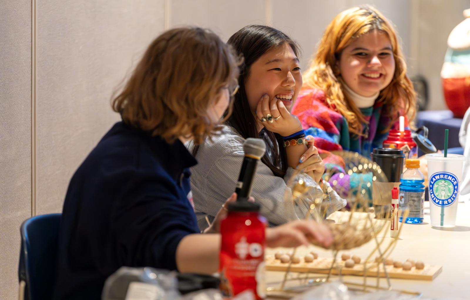 Students share a laugh during Bingo in Warch Campus Center.