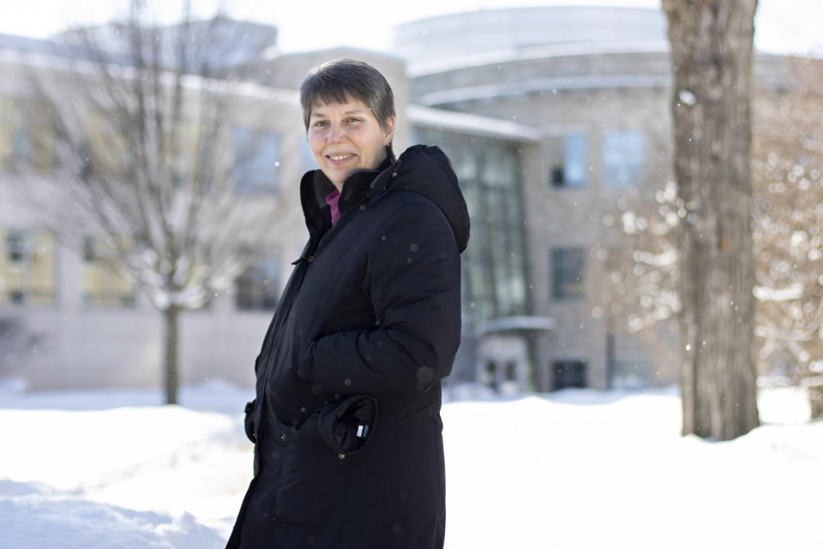 Nancy Wall poses for a portrait in winter on Main Hall Green.