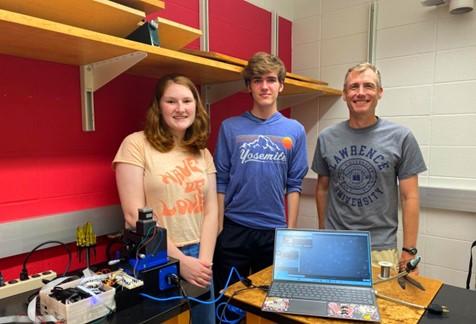 Doug Martin (right) works on research with students Grace Weber ’24 and Joseph Carpenter ’25.
