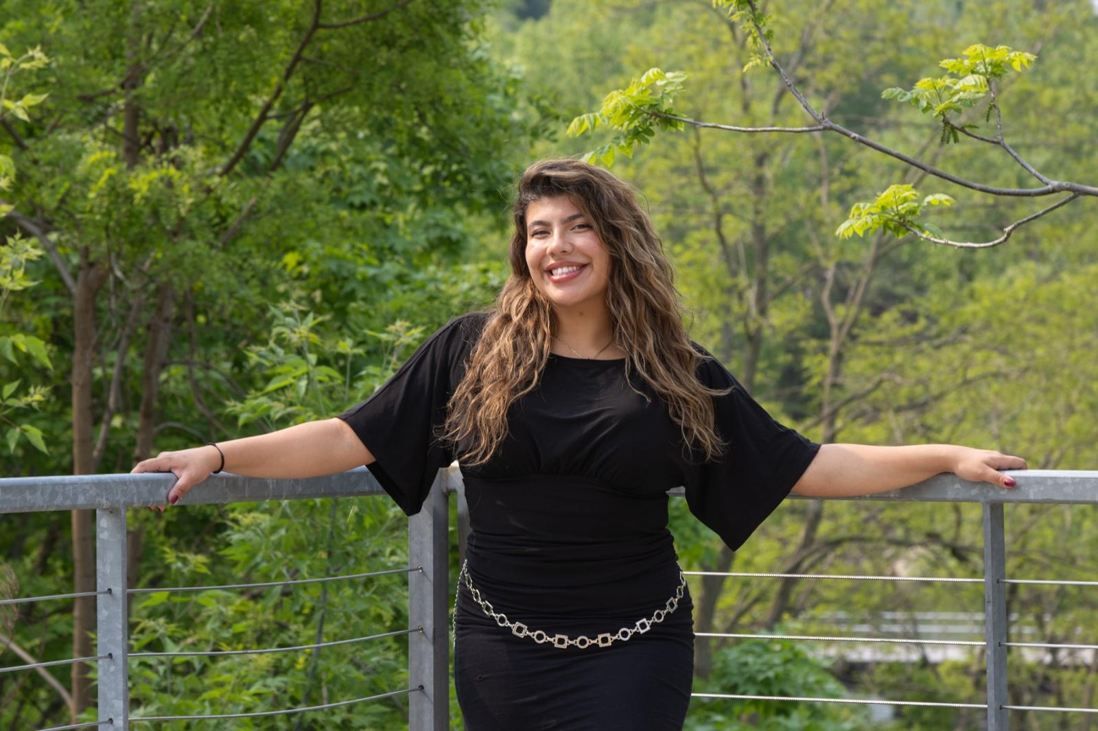 Bruna Velez is all smiles as she poses for a photo on campus.