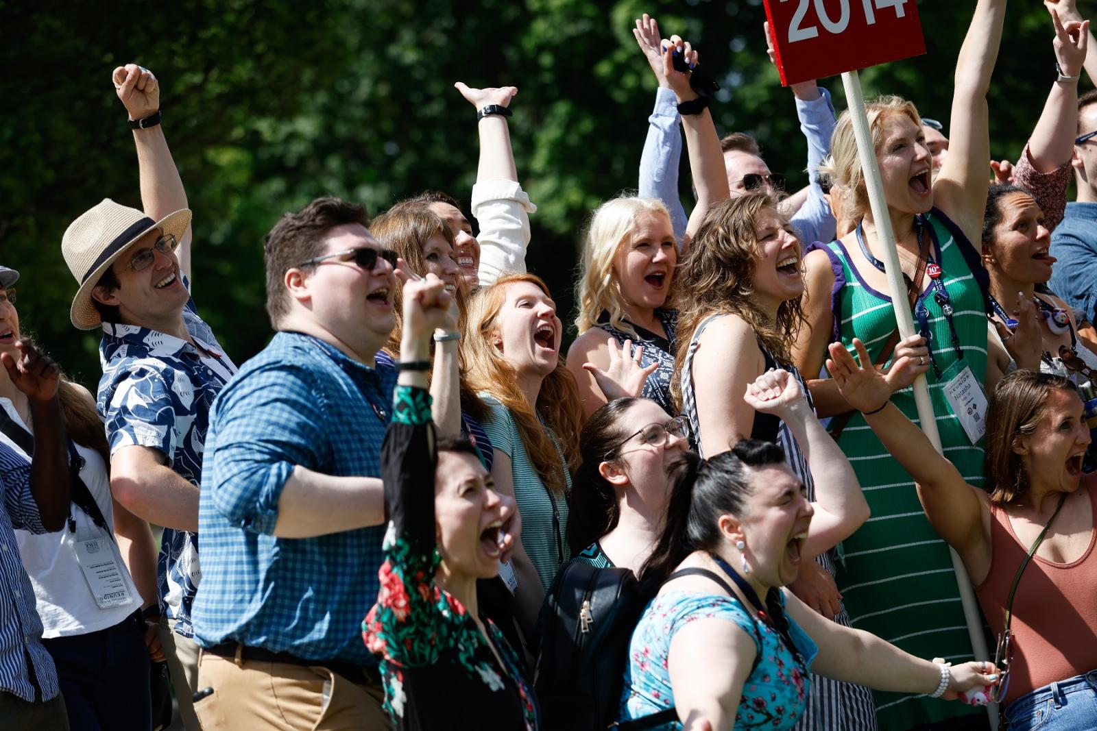 Graduates cheer for photo during Reunion 2024